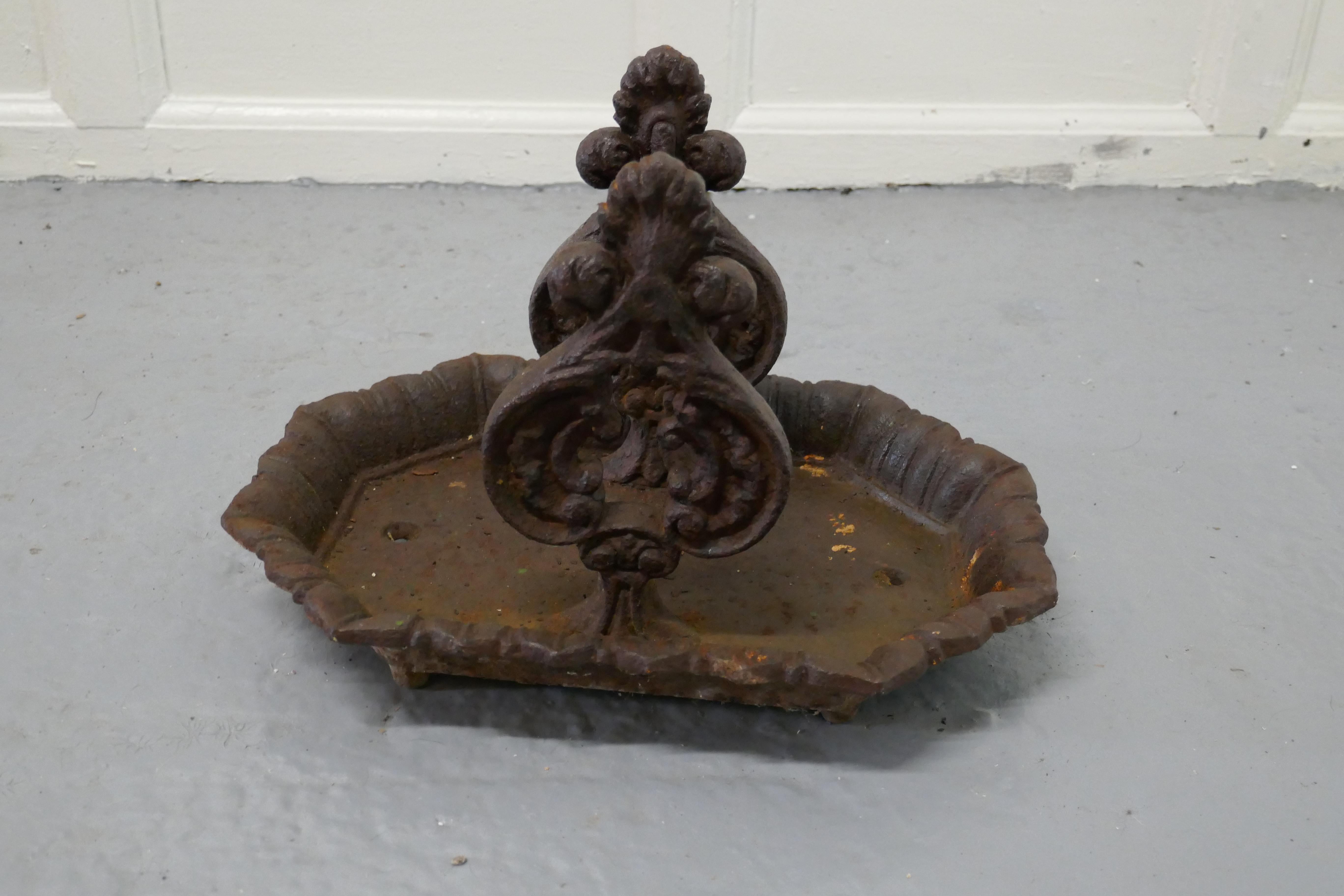 Victorian cast iron boot scraper by T Holcroft & Sons Ltd Wolverhampton

This is a very old piece, it is very heavy, the scraper is set on a large tray which has a decorative edge has
It has never been painted it is well weatherd and used but