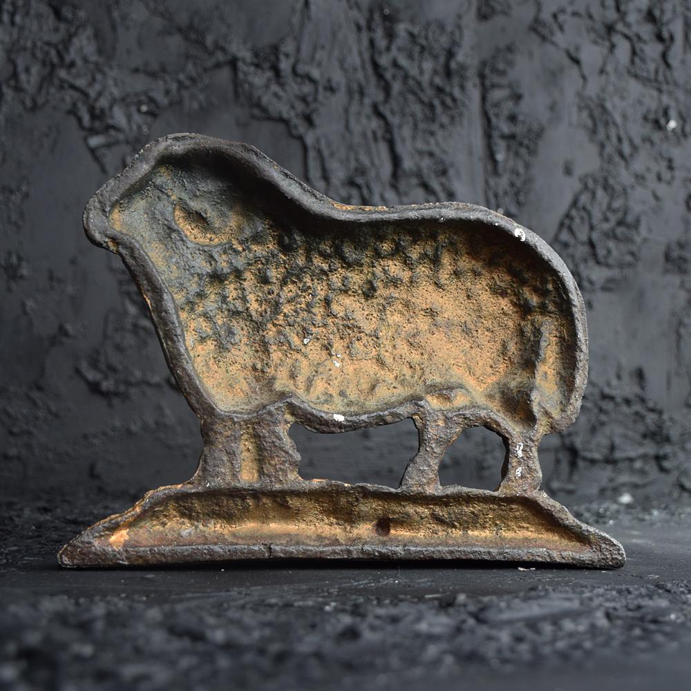 19th century door stop 

We are proud to offer an authentic Victorian cast iron door stop in the form of a golden fleeced ram figure. A single sided weighted object that would have been used to prop open heavy country house and estate doors in the