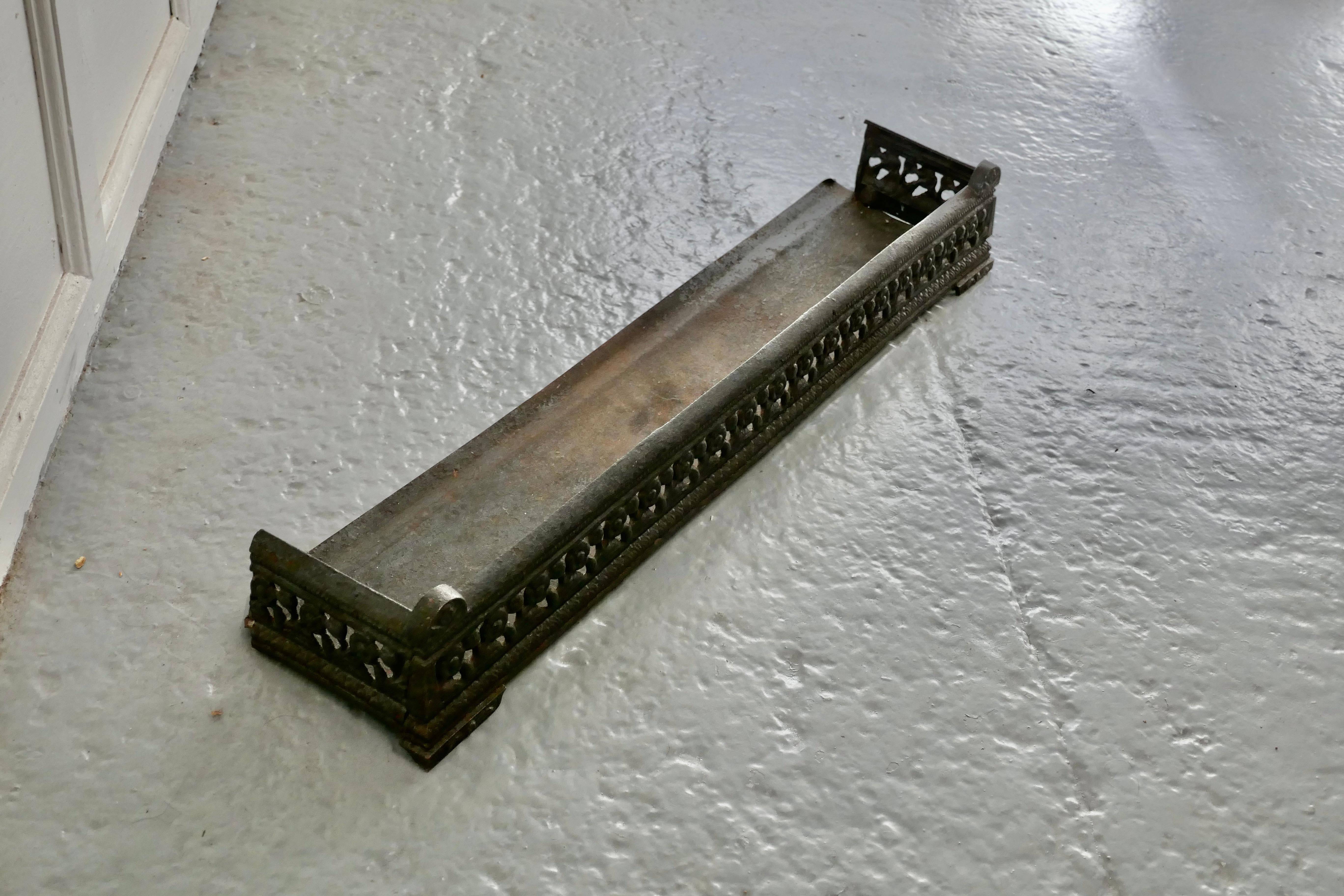Victorian cast iron fender or dog grate.

This is a good Victorian fender it is good and heavy, fenders like this were known a dog grates as they serve to rest the fire tools and keep any rolling ash in check
The fender is in good sound condition