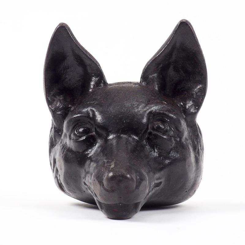 Victorian cast iron fox head door stop, circa 1880. This kind of doorstop was popular in England in the late 19th century and would have been placed against the door with snout pointing upward. These doorstops took the form of traditional stirrup