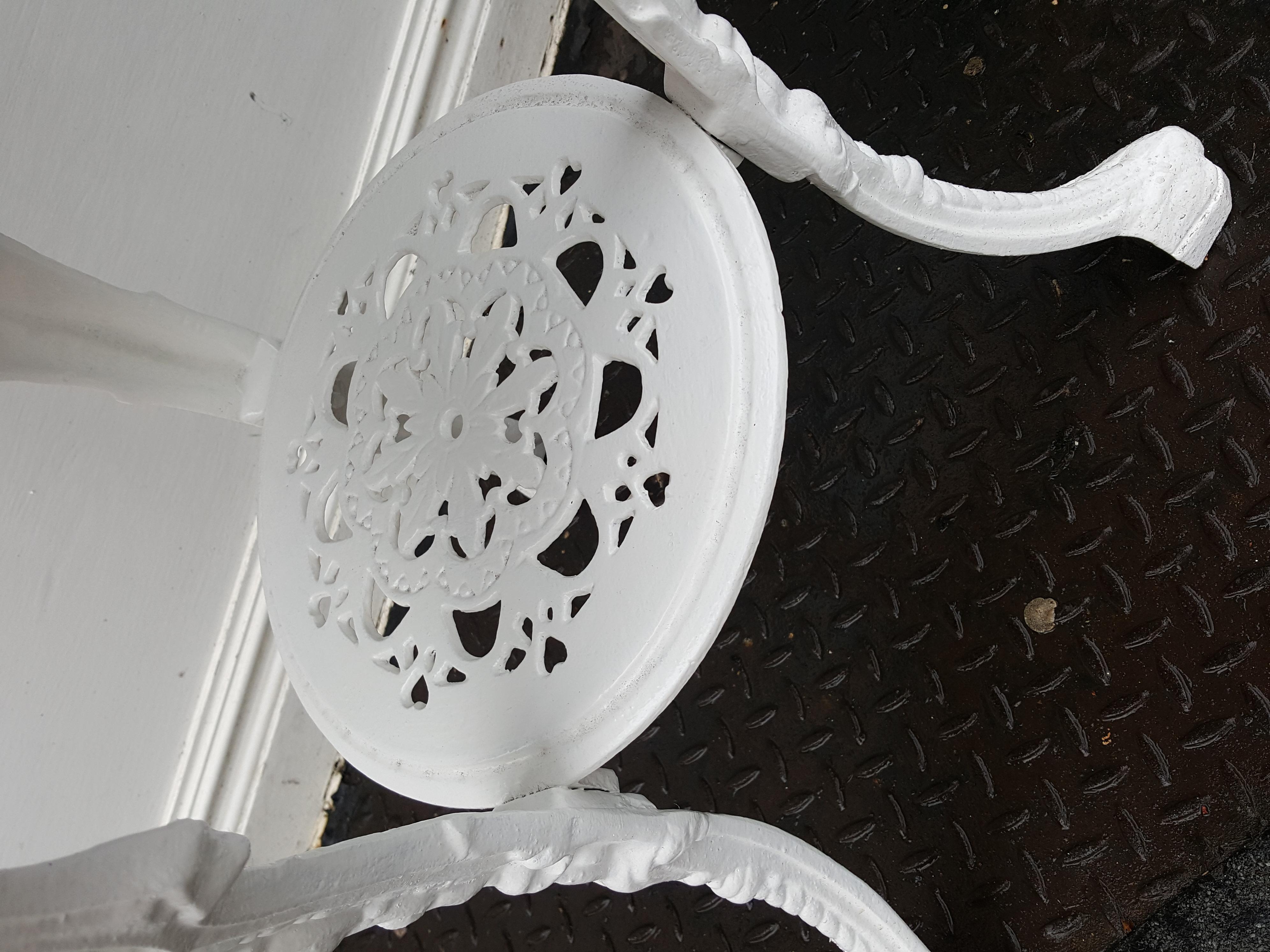 Victorian cast iron garden table with mahogany top decorated with Britannia cast portrait, hearts and lion paw feat 24