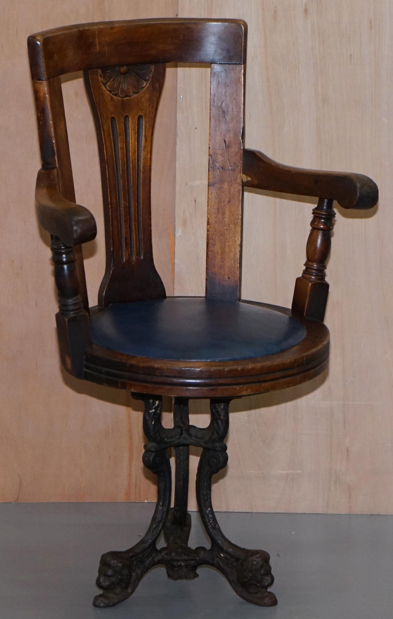 We are delighted to offer for sale this absolutely stunning mid Victorian Ships Swivel armchair on a solid cast iron base with Lion head detailing

A very good looking and decorative chair, the timber is Walnut, the seat base blue leather, and the