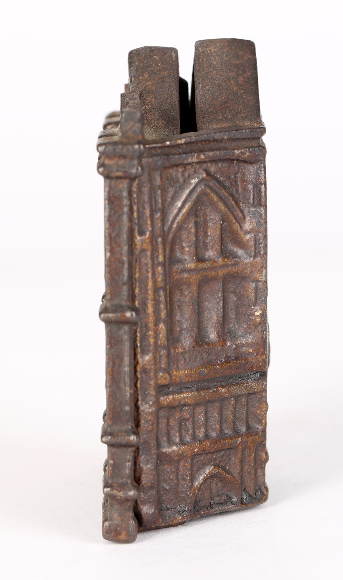 A good antique Victorian cast iron money box modelled as a Bank building dating from the 19th century. The money box is cast in two parts and simply assembled with a removable screw. The money box is formed as a tall elegant traditional building