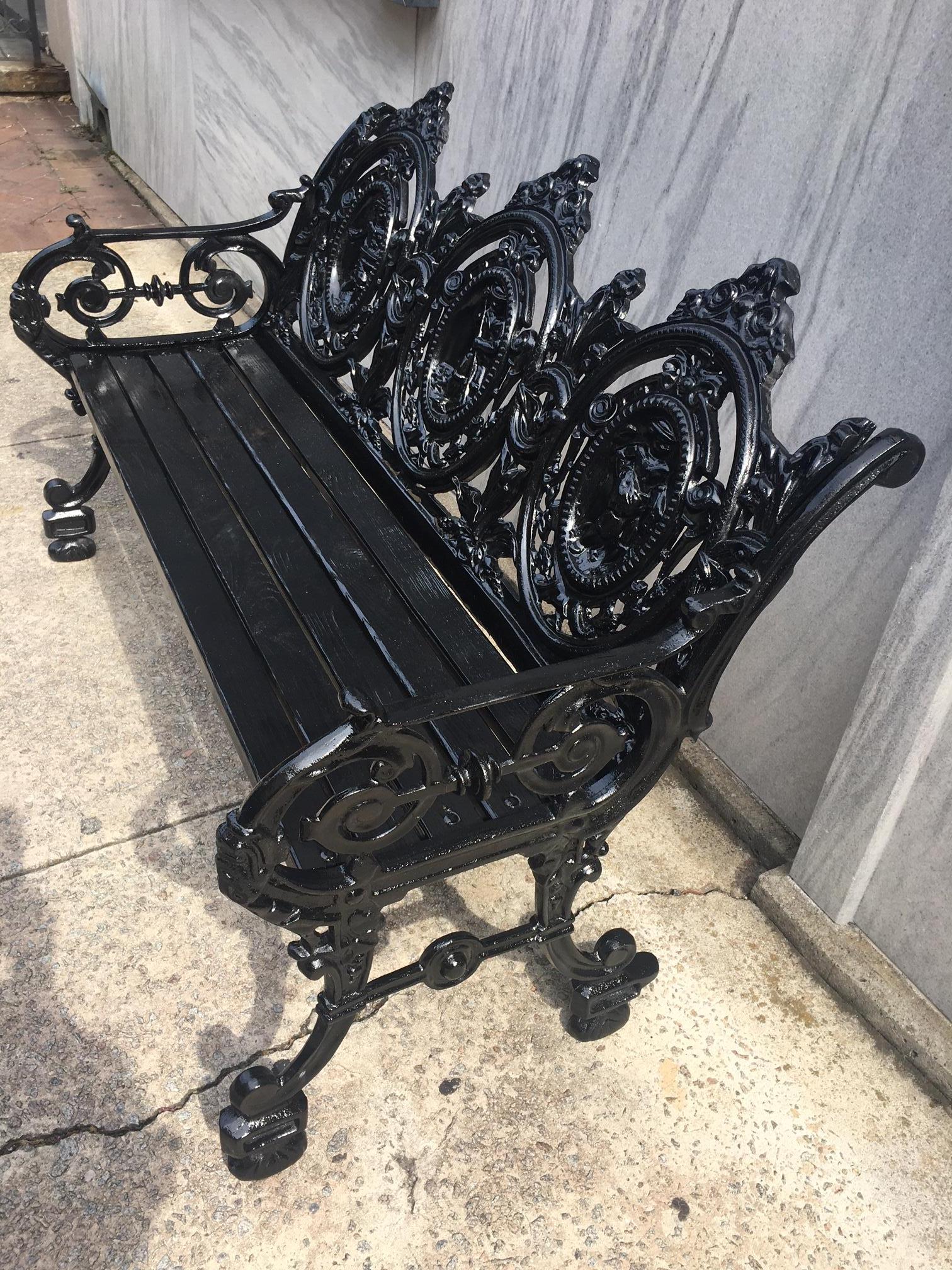 Victorian Cast Iron Three Paneled Ornate Garden Bench with Pine Slat Seat In Good Condition For Sale In Savannah, GA