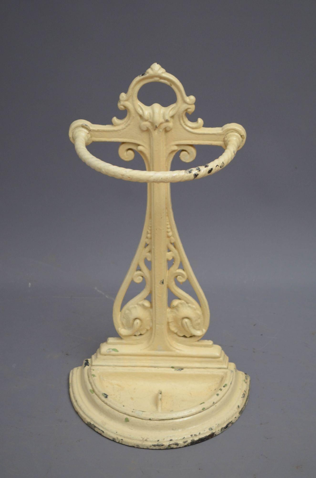 Sn4877 Victorian cast iron umbrella stand of pierced and scrolled design with demi lune umbrella holder and removable drip tray, all in home ready condition. c1880
H25