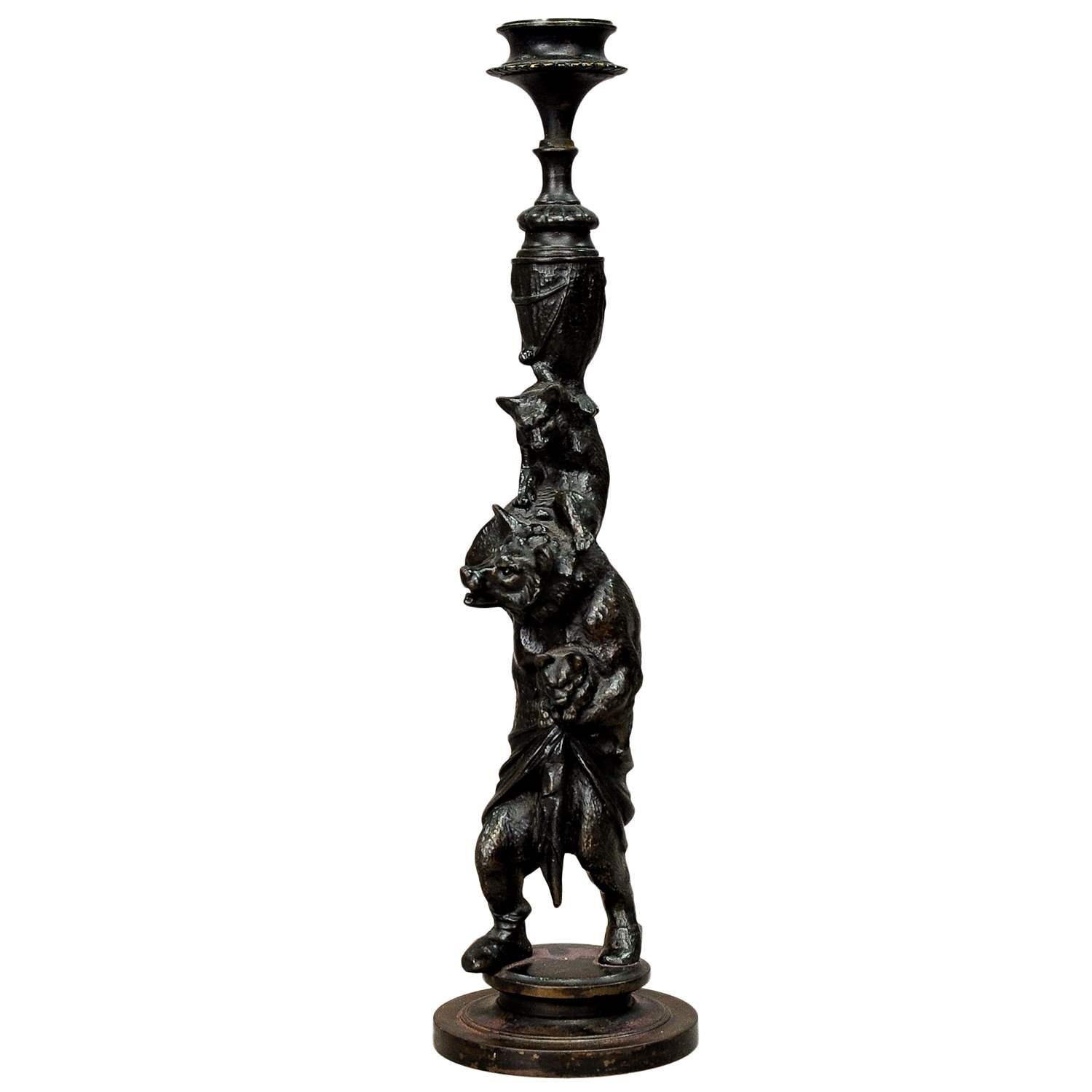 Victorian Casted Iron Candle Stick with Bears

A great Victorian casted iron candle stick, Germany circa 1860. It is depicting a mother bear holding one cub in her left paw and another one on her back. The art craft is signed with foundry mark F. L.
