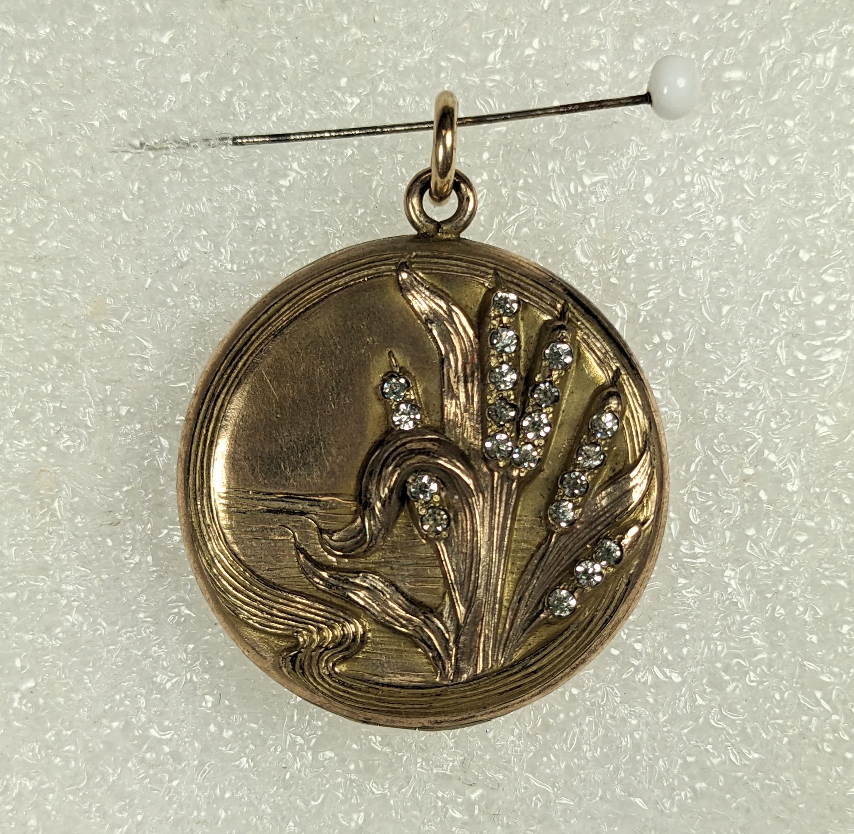 Victorian Cat Tails Gold Filled Paste Locket from 1900. Art Nouveau motif of cat tails in a pond, Signed W&H Co. in heart. Initials on back.
1