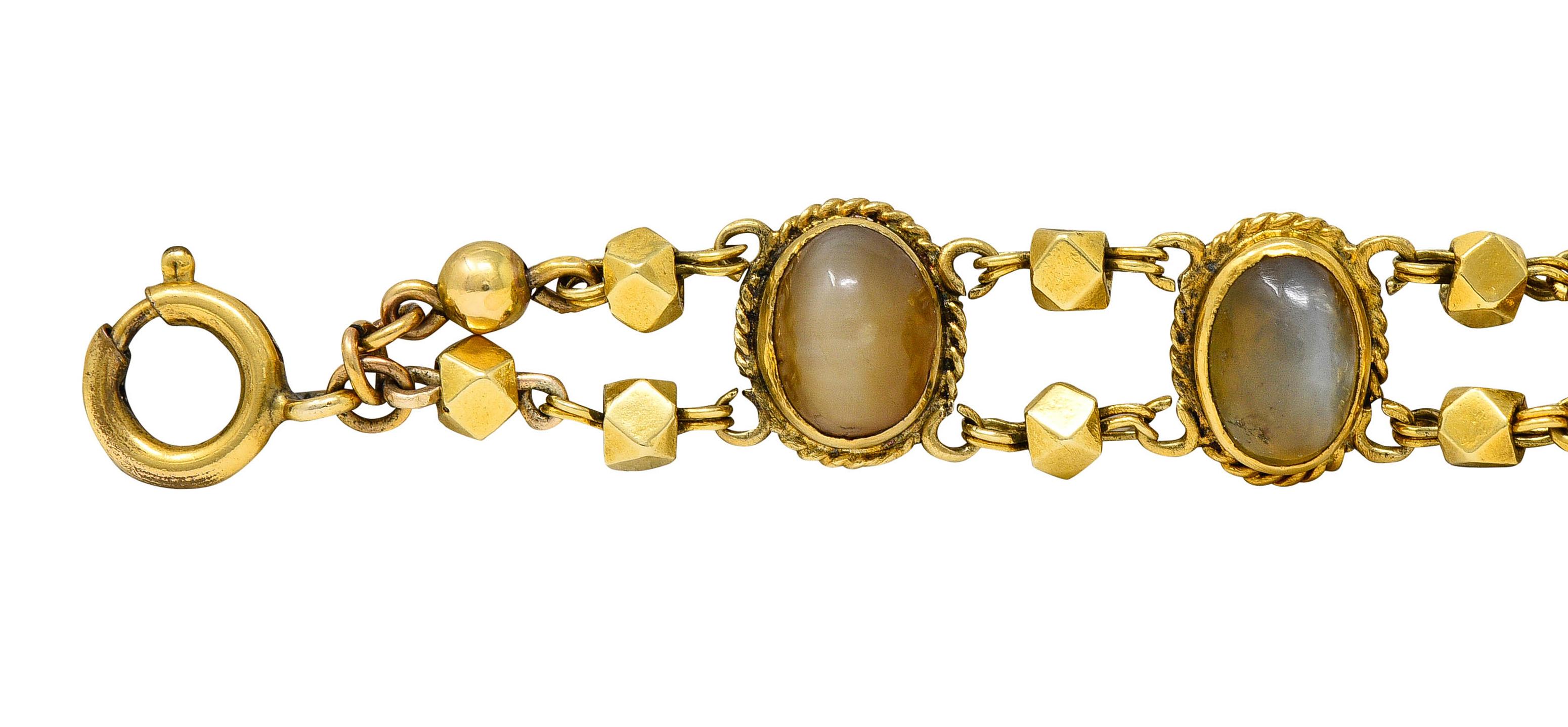 Bracelet is comprised of gemmed oval links alternating with faceted gold spacer beads

Featuring oval cat's eye chrysoberyl measuring from 9.0 x 6.5 mm to 7.0 x 5.5 mm

Well matched translucent brownish olive green in color with moderate to strong