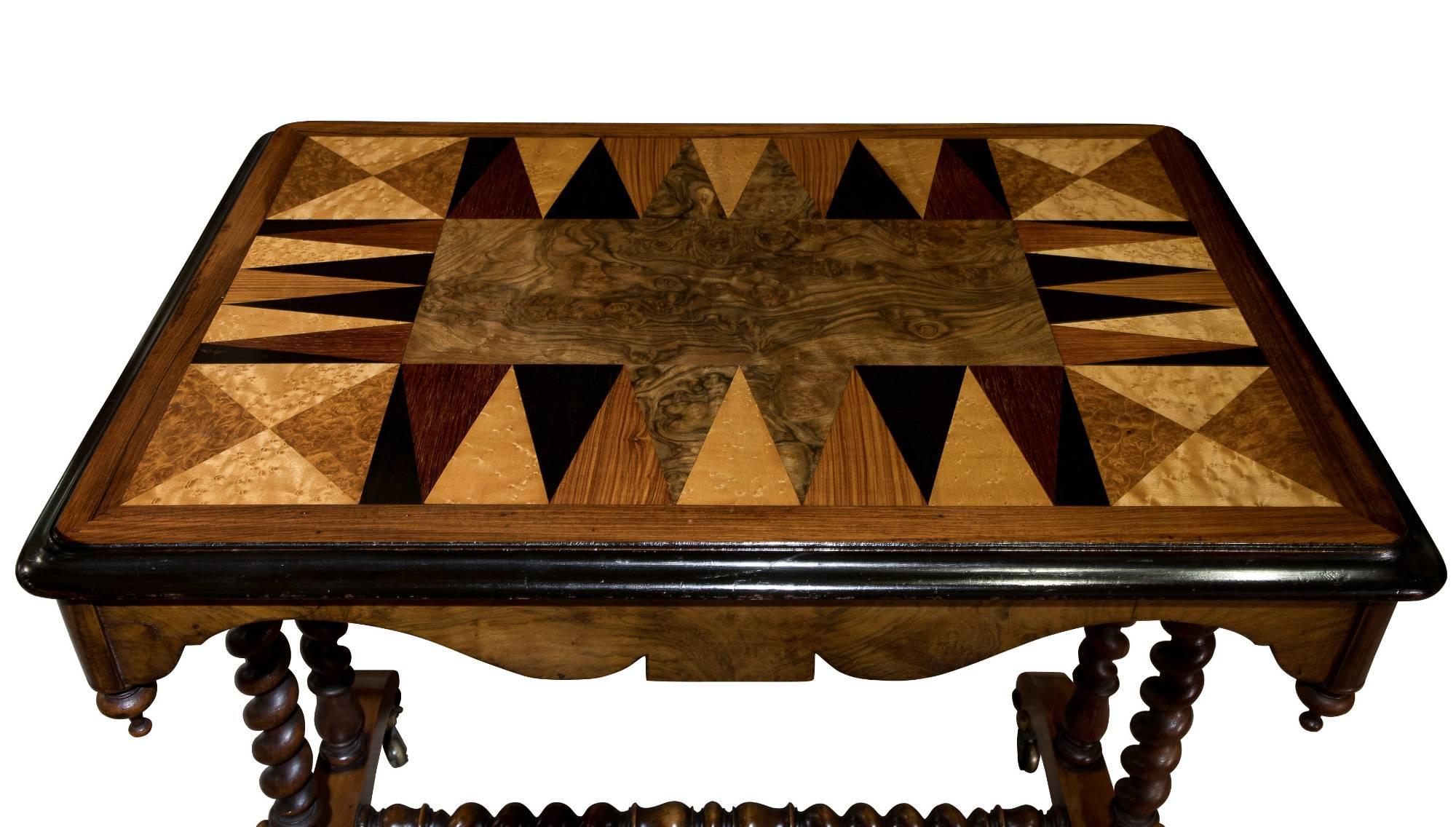 A Victorian specimen timber top centre table, rectangular top raised on barley twist supports united by a centre stretcher, on castors.