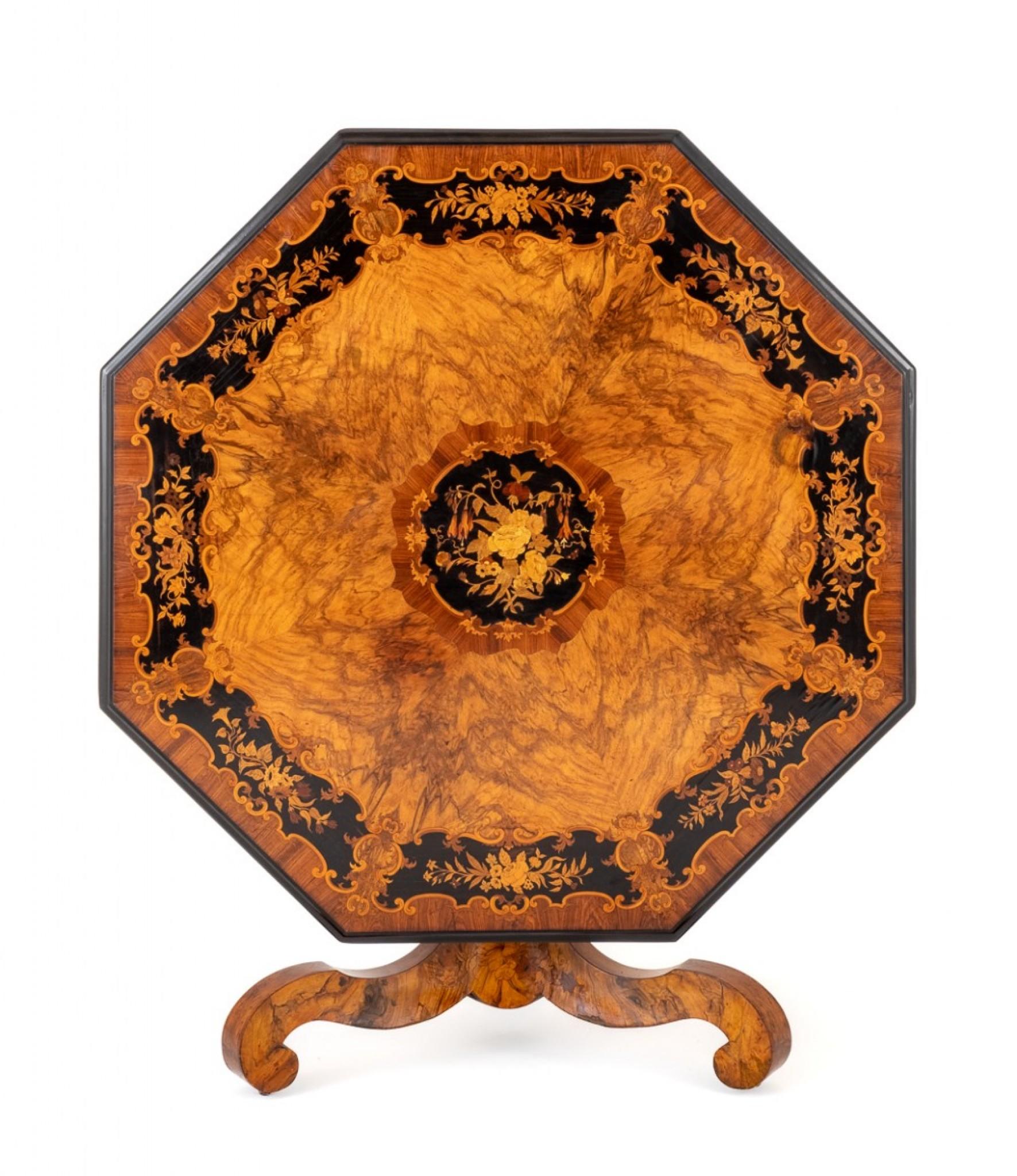 A Stunning Walnut and Marquetry Centre Table.
The Table is Octagonal in Shape with a Central Marquetry Panel.
The Border Also with Marquetry Panels Set in Ebony.
The Frieze of the Table Being of Burr Yew Wood with Rosewood Cross-banding.
The