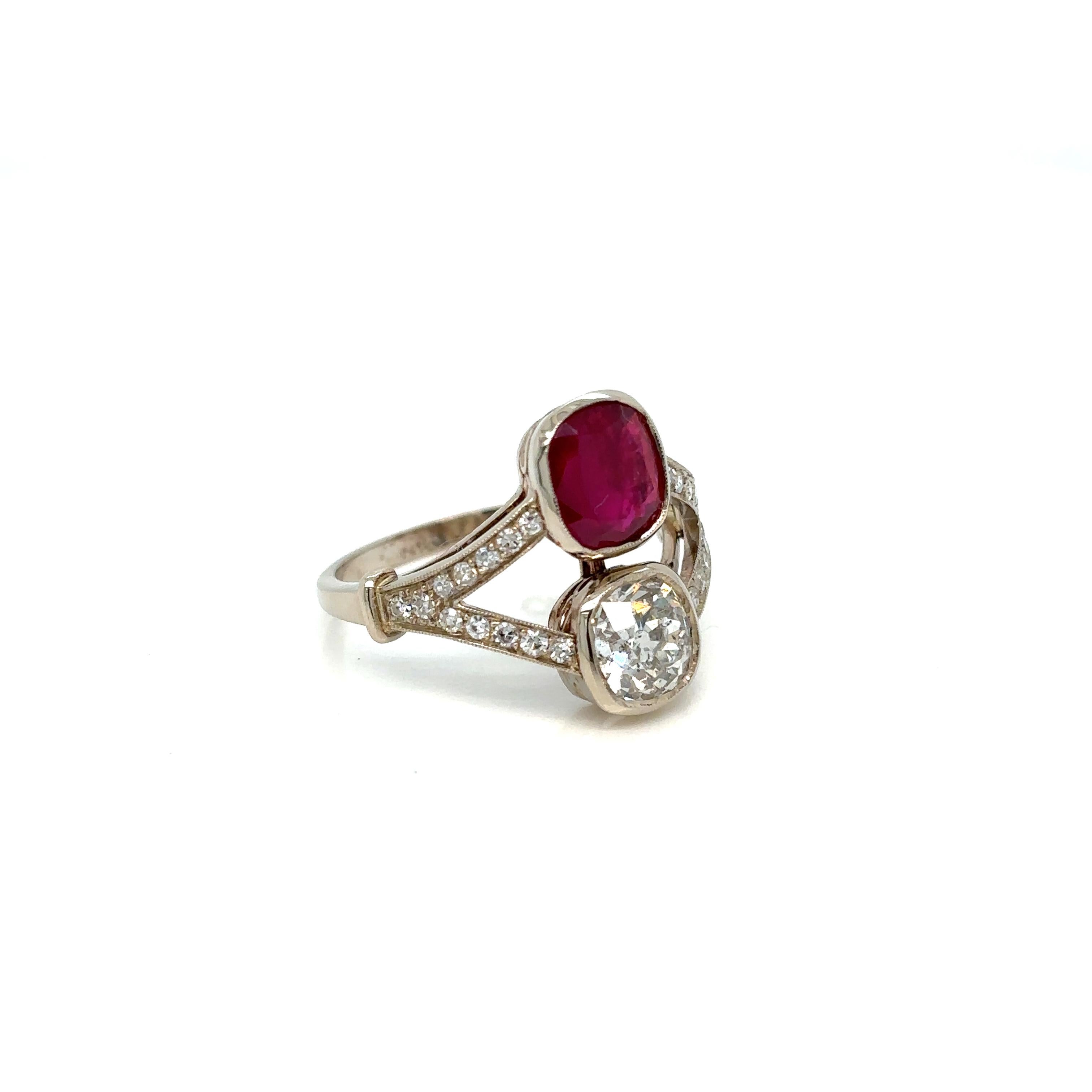 This Beautiful Authentic Victorian 18k gold 'Vous et Moi' ring is set in the center with one Certified vivid Natural unheated Ruby, 1.53 ct., and one Sparkling Old mine cut diamond weighing approx. 1.00 ct., graded H color I1.  The mount is enriched