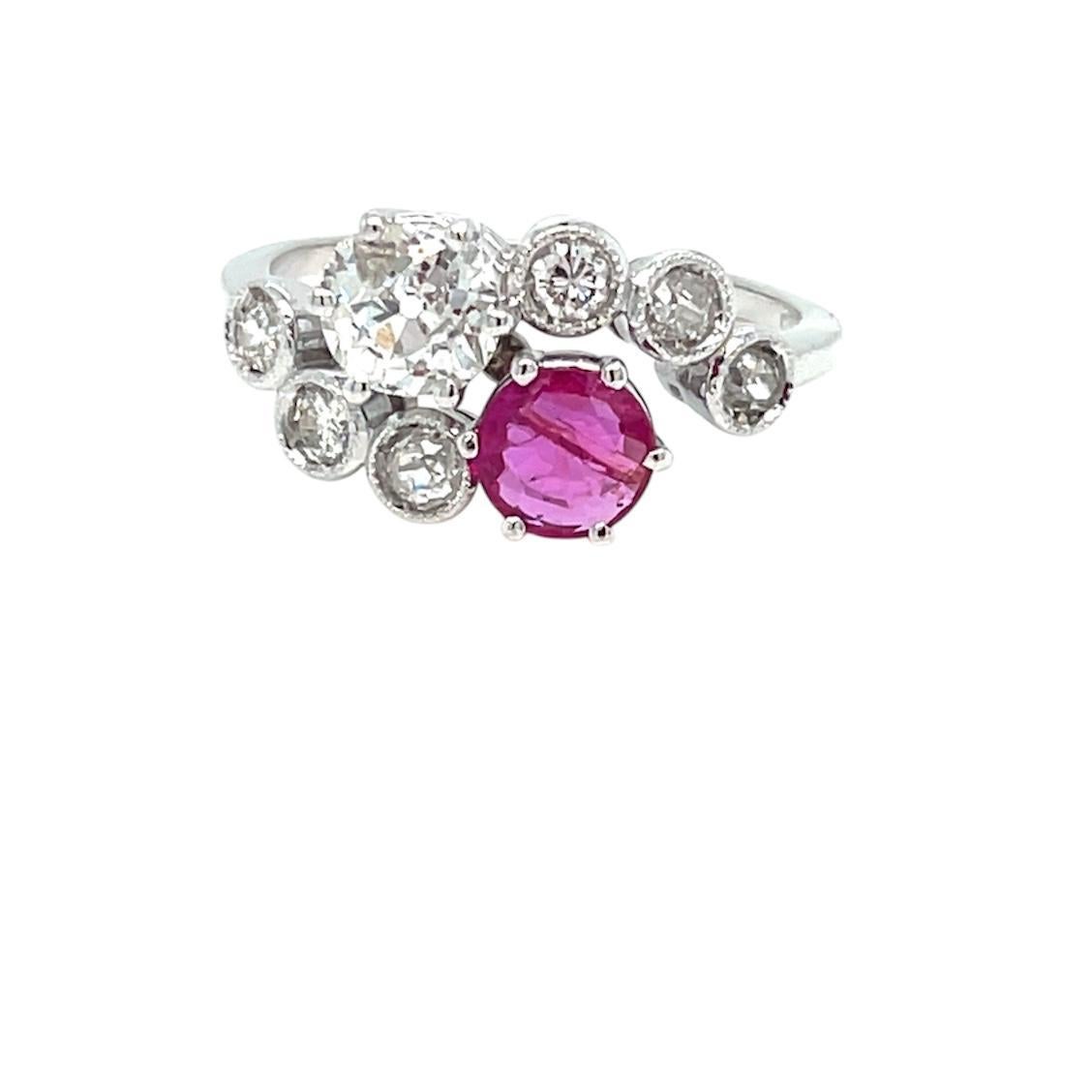 This Beautiful Authentic Victorian 18k gold 'Vous et Moi' ring is set in the center with one Certified vivid Natural unheated burmese ruby, 0.65 ct., and one Sparkling Old mine cut diamond weighing approx. 0.90 ct., graded H color SI3.  The mount is