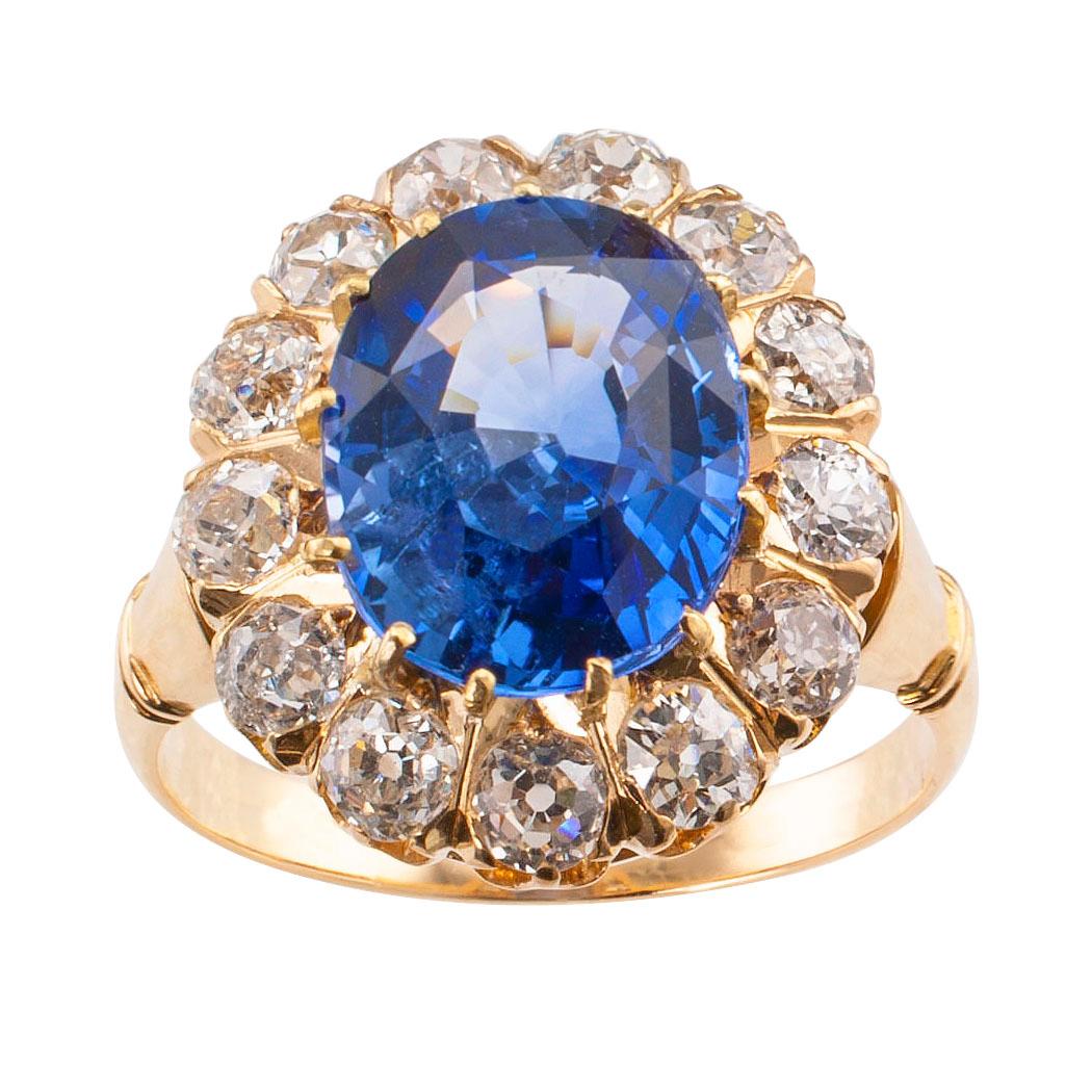 Victorian Ceylon sapphire diamond and gold ring circa 1890. Centering upon on oval blue sapphire weighing 4.68 carats, accompanied by a report from GIA stating that the sapphire is heated and its country of origin is Sri Lanka (Ceylon), within a