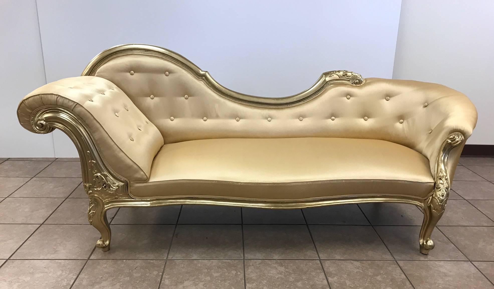 1880s Victorian carved walnut chaise lounge daybed painted in a metallic gold finish newly upholstered in gold satin.