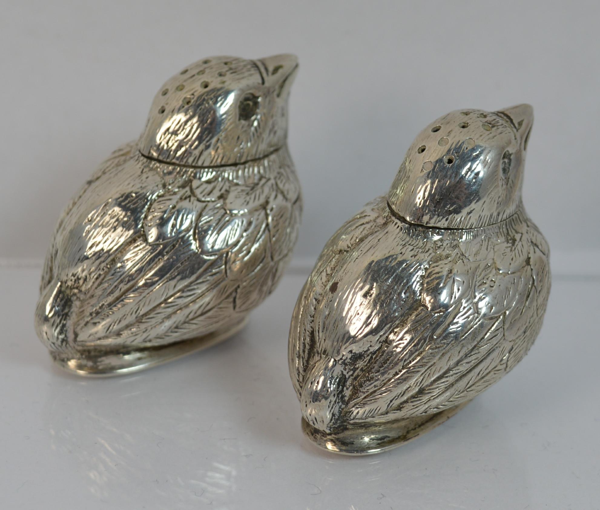 

A fantastic pair of early Asprey hallmarked bird shaped salt and pepper shakers.

Very finely made with hallmarked to base. Light gilt insides can be seen when the bird heads come off.

Well made pair retailed by Asprey.

Hallmarks ; full