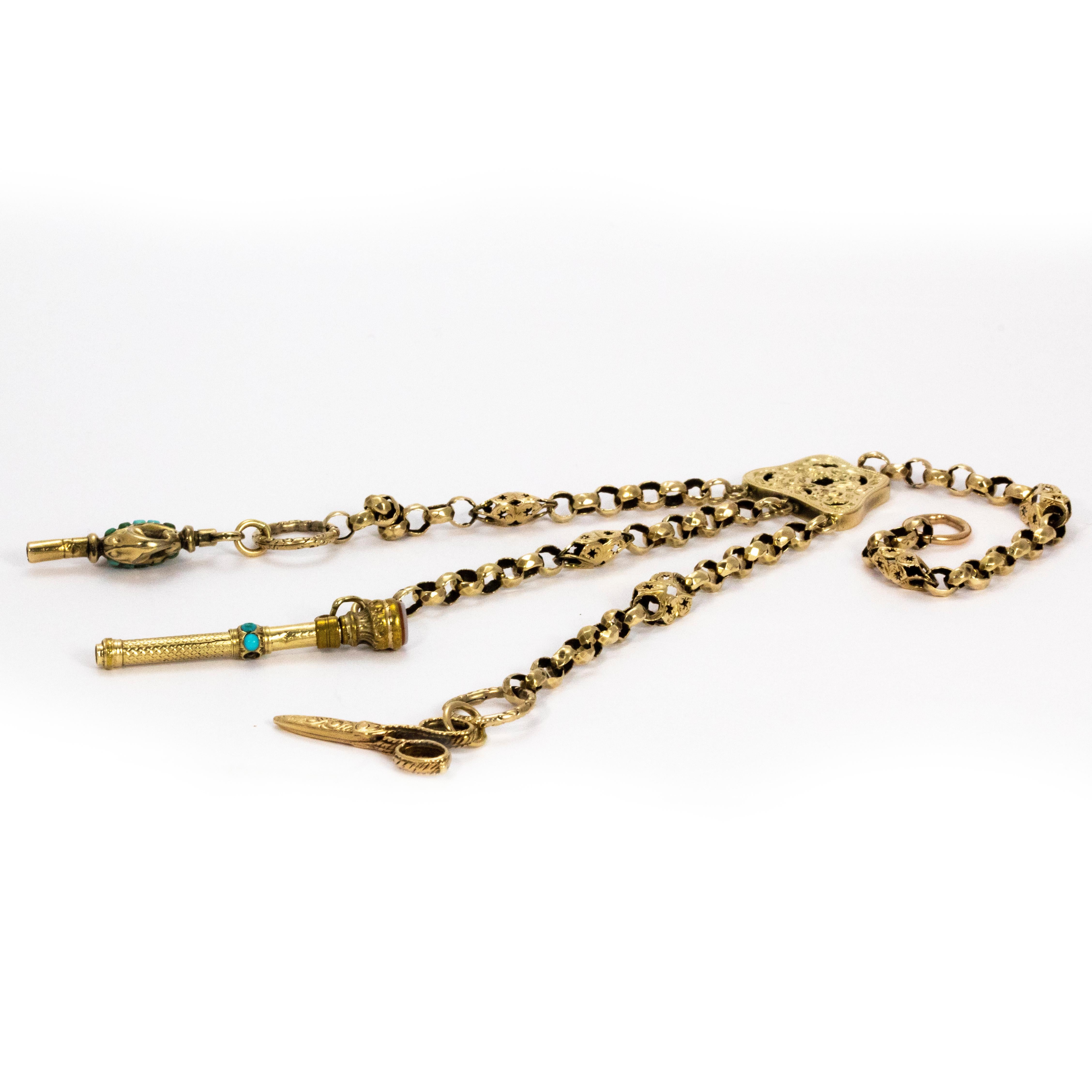 What a stunning piece! A wonderful example of a victorian chatelaine chain made with 9ct gold and decorated with turquoise. Two of the lengths of the chain hold charming details, one being a pair of scissors and the other a key. The whole chain