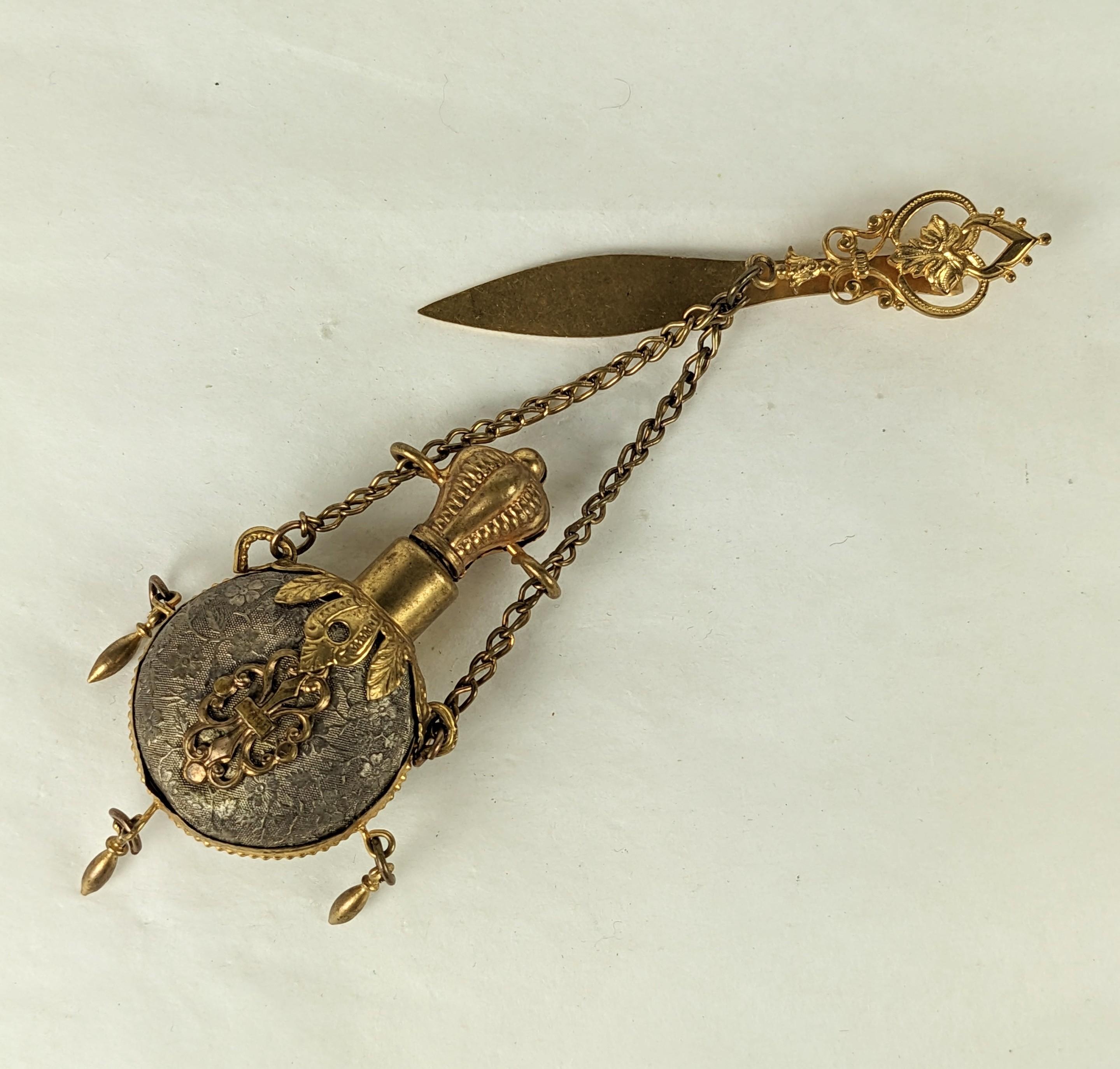 Victorian Chatelaine Perfume from the 19th Century of gilt and silver gilt metal. Retains original hook to hang from belt as well as matching vial with original cork and glass liner. Typically Victorian design details with a play of gilt and etched