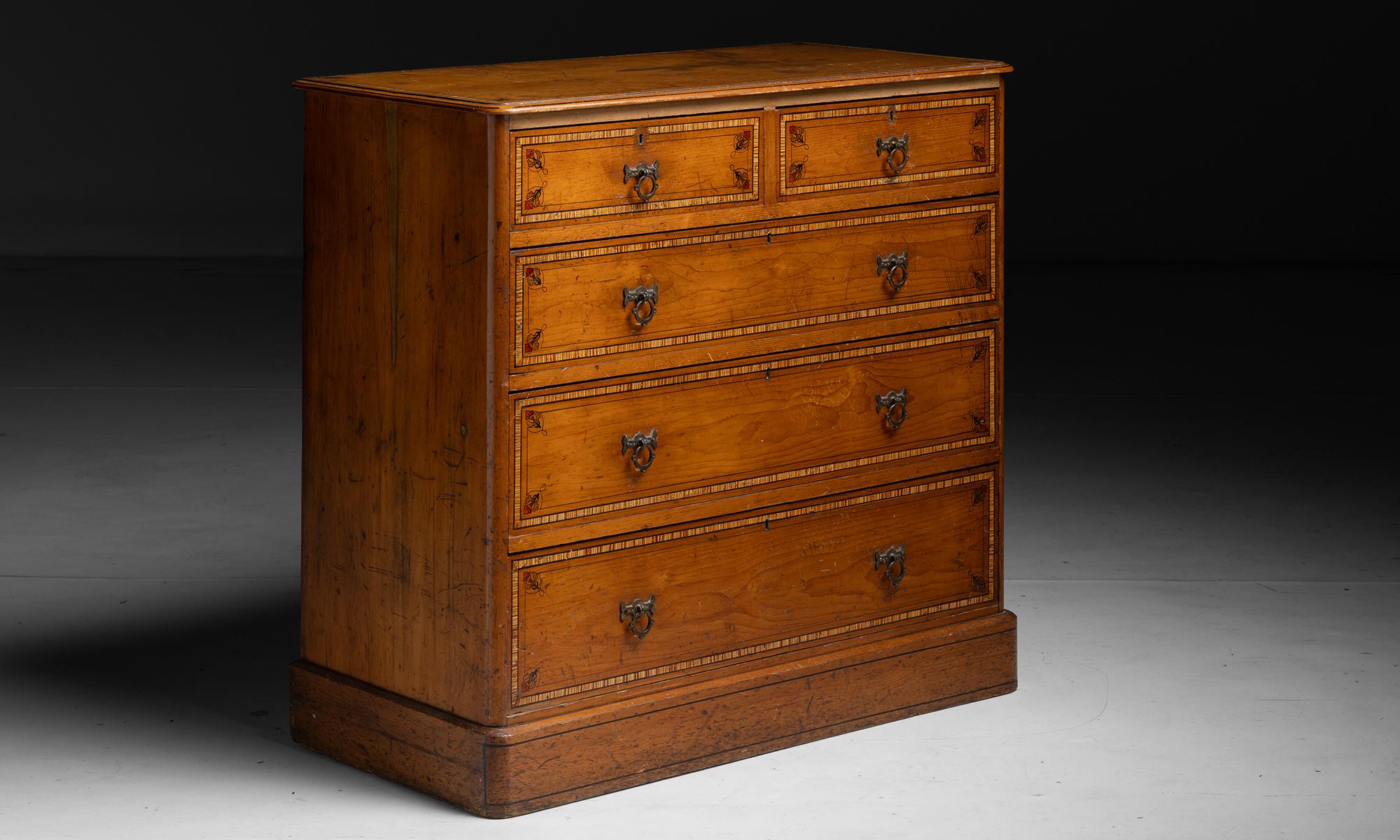 Victorian Chest of Drawers

England circa 1890

Grained pine chest with painted ebonies stringing, foliate ornament and faux cross banding.

Measures 42”w x 20.5”d x 39”h