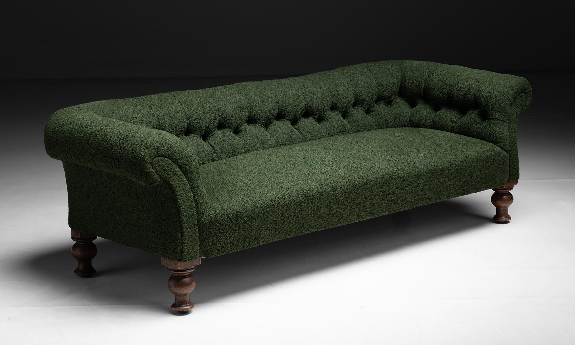 Victorian Chesterfield Sofa

England circa 1900

Newly upholstered in forest green boucle, on antique frame.

Measures 83”L x 35”d x 25”h