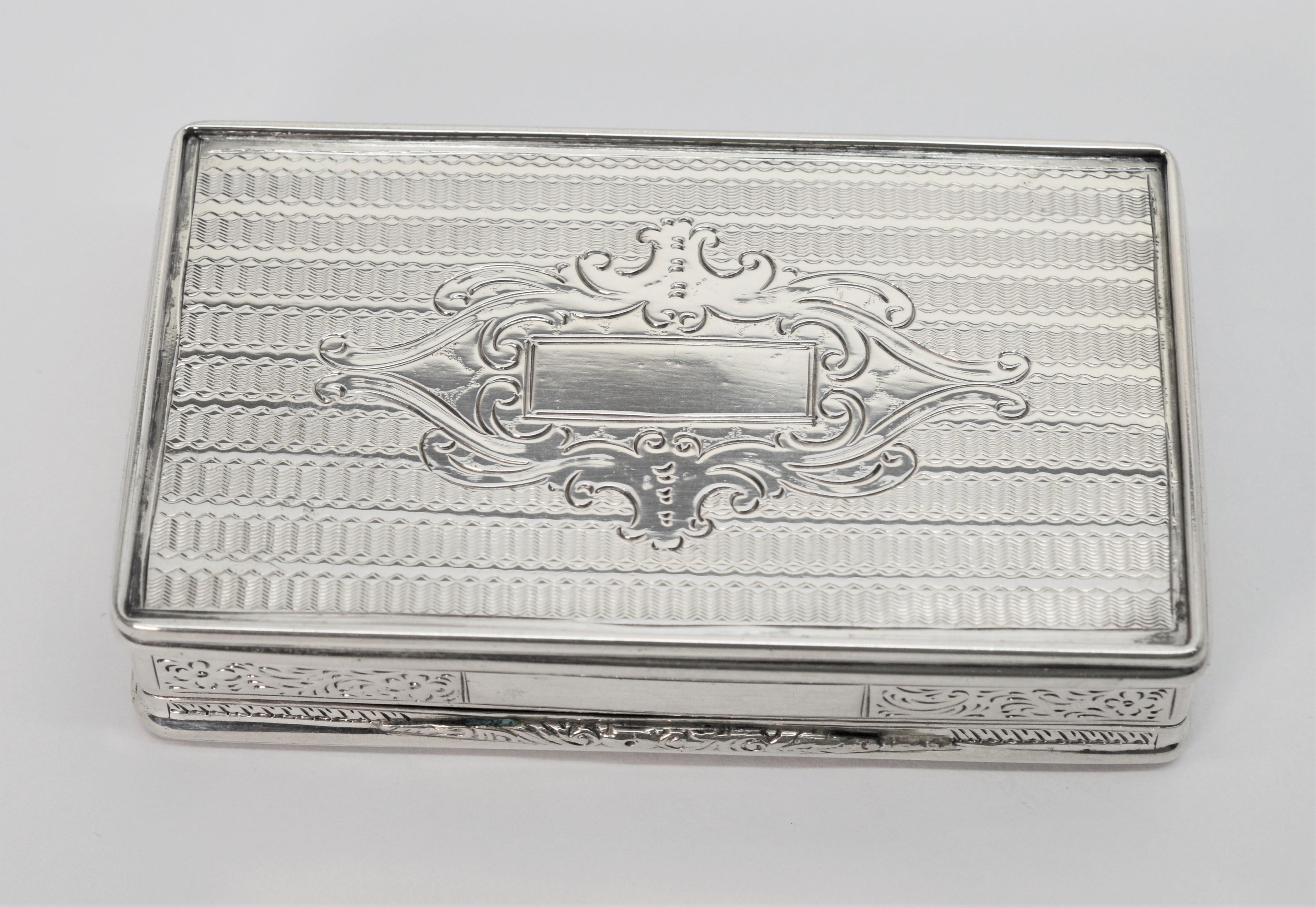 This spectacular heirloom piece has made its journey forward from the Victorian period. Made of .800 silver, the cigarette or snuff box is stamped with hallmarks, dated 1859 and signed IFH. The piece is hand engraved with a decorative design on all