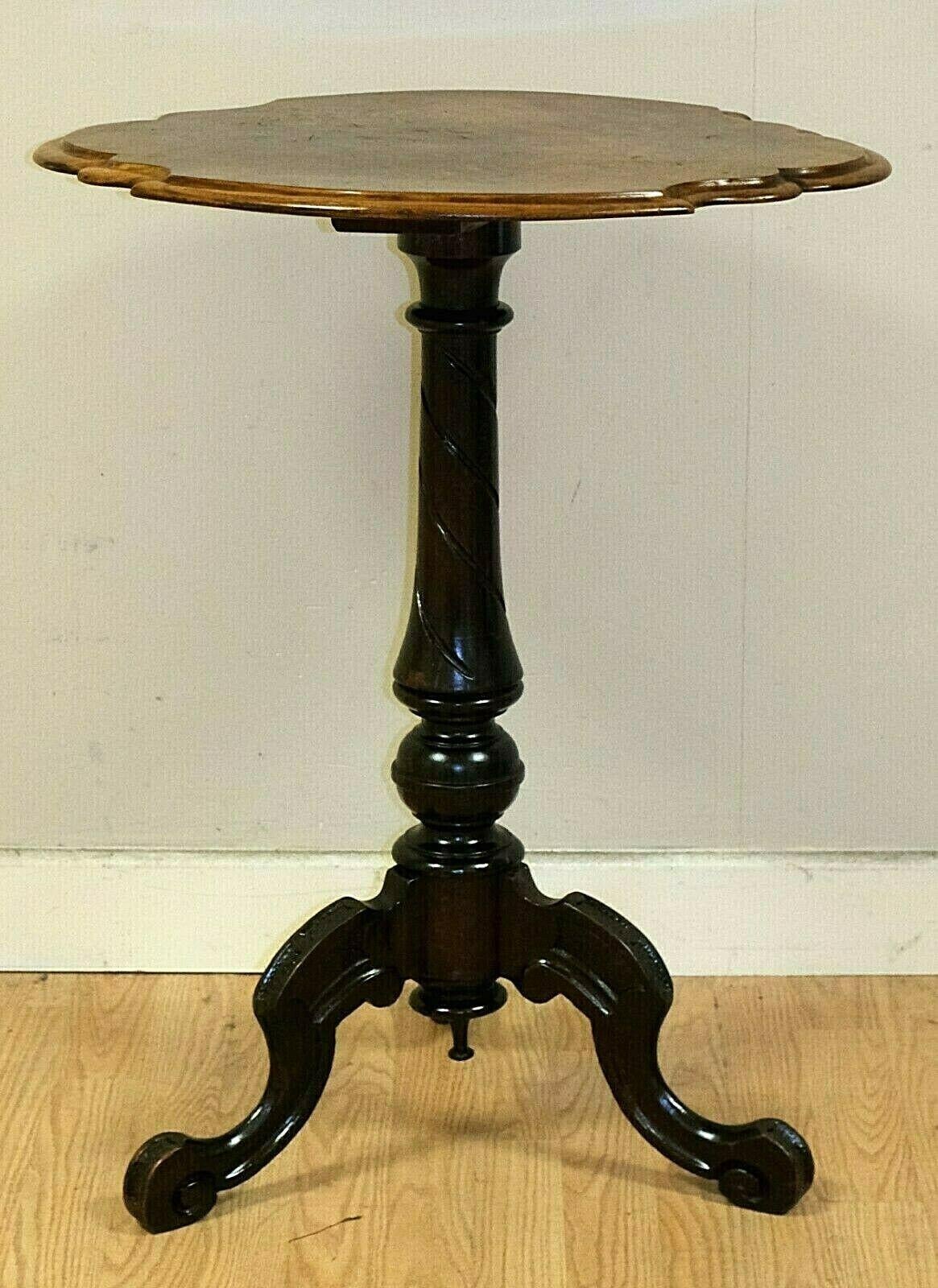 We are delighted to offer for sale this elegant burr walnut side tripod table with scalloped edge.

The particular shape of table will look attractive in any room. The carving on the legs is simple yet makes a perfect combination with the rest of