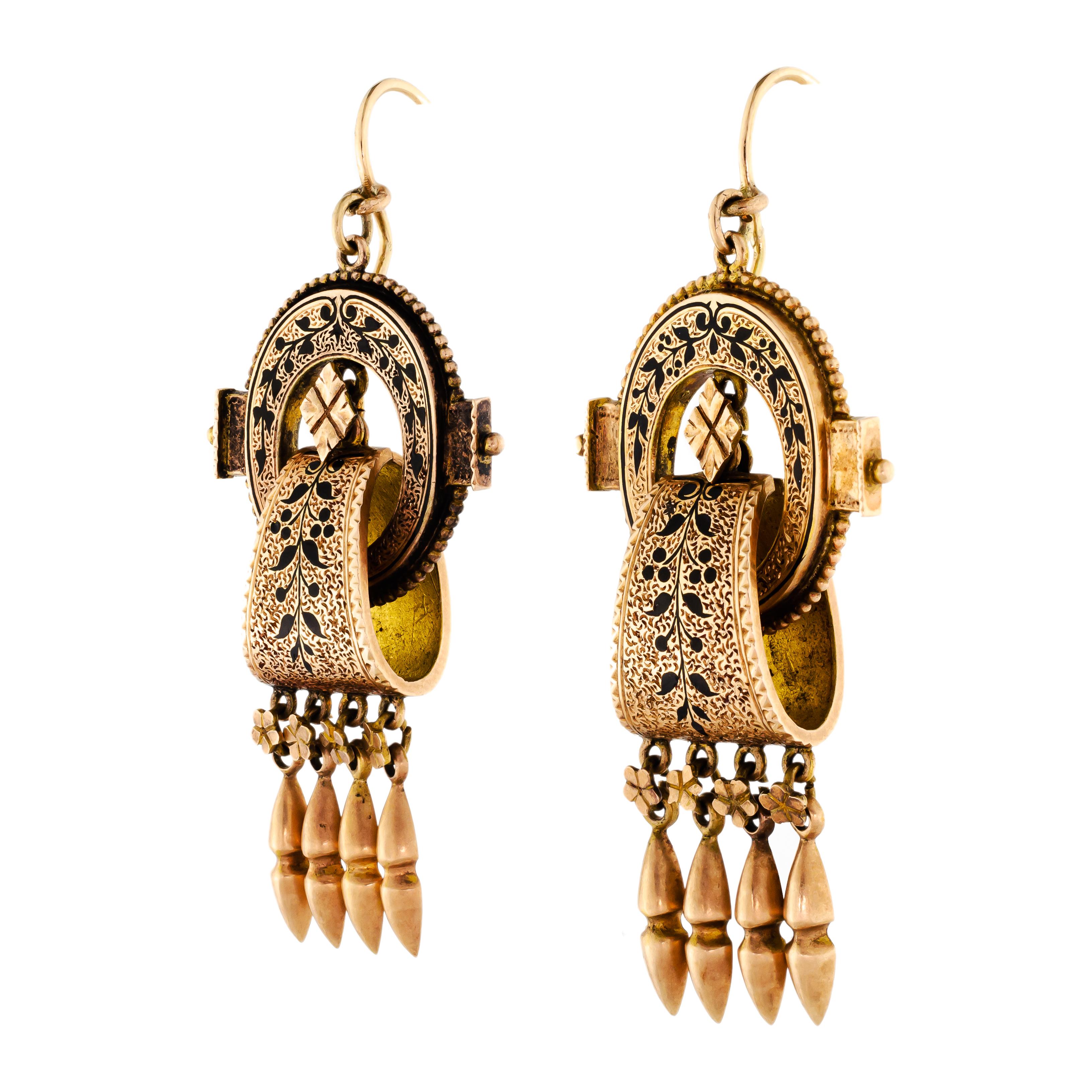 This outstanding pair of Victorian circa 1865 14kt yellow gold and black enamel tracery long pendant drop earrings of fine detail is simply fabulous. Three dimensional - floral engraved gold with applied gold details all embellished with black