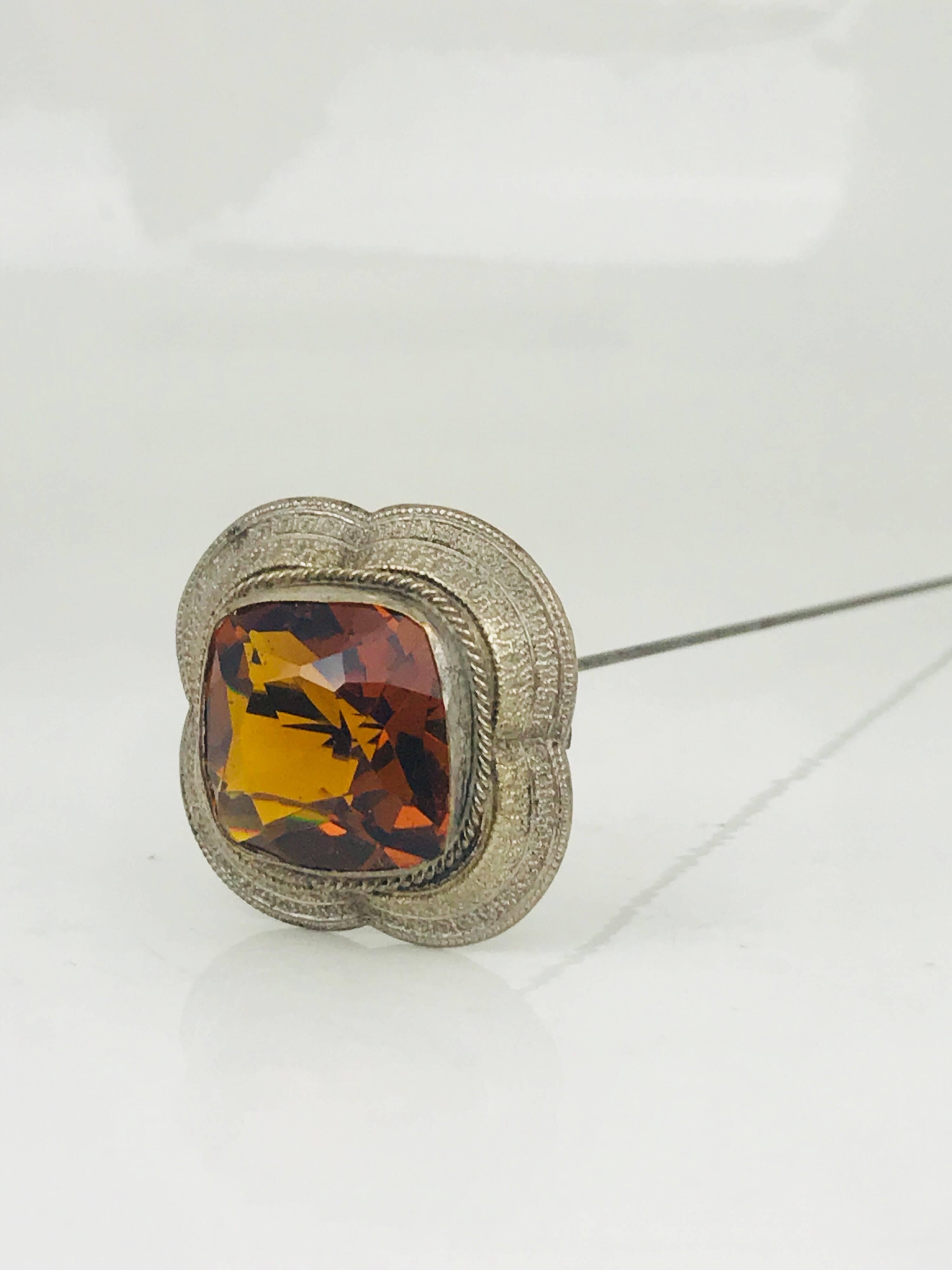 Victorian, Hand Made Hat Pin features a large, sparkling orange, faceted, cushion-cut, bezel-set in a scalloped mounting. Circa 1870

Cushion-cut measures .76