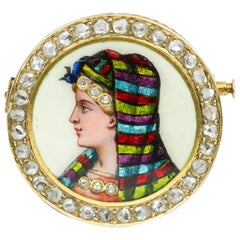 Broche circulaire victorienne en émail avec tête de femme