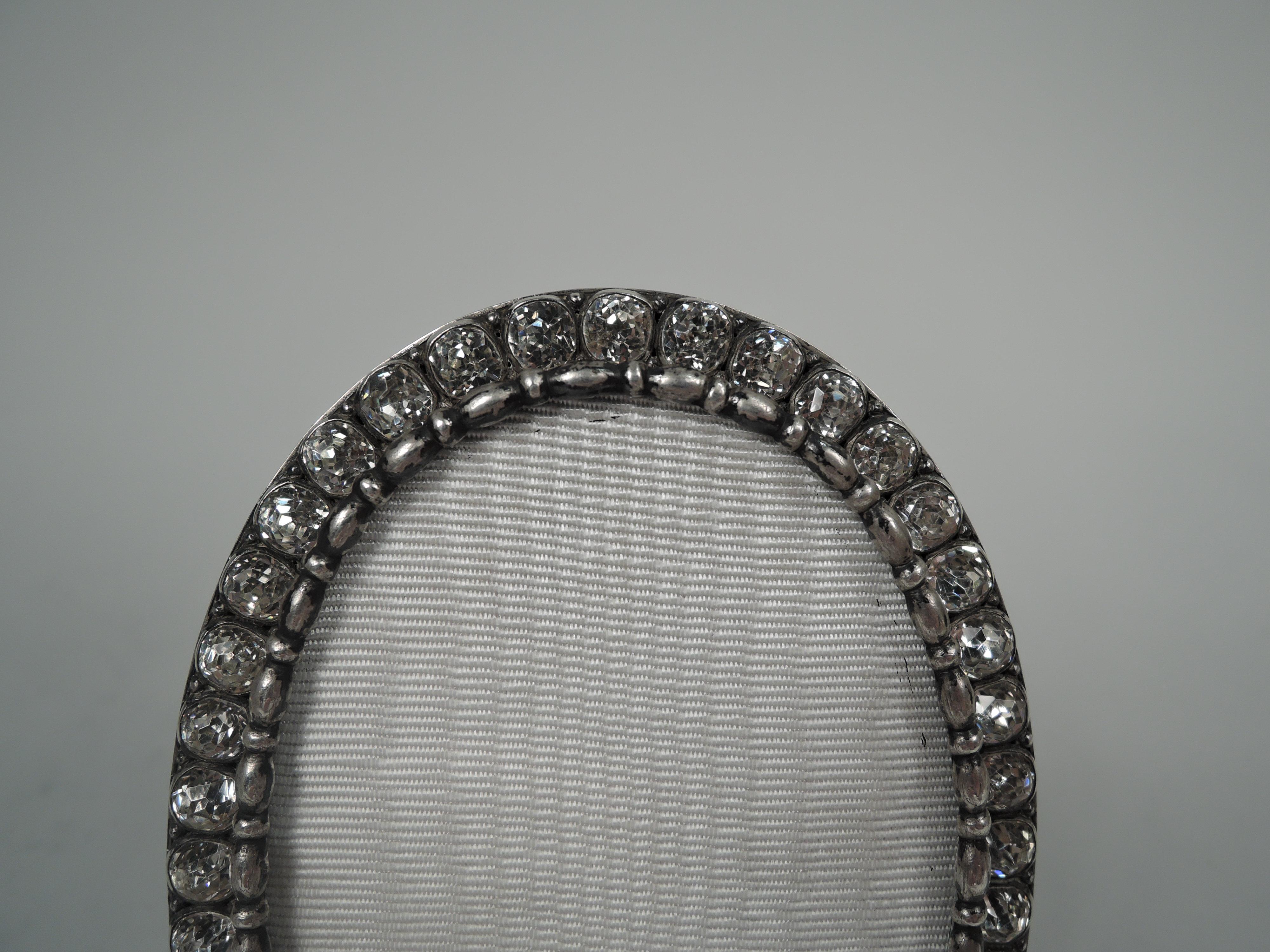 Victorian Classical sterling silver picture, ca 1900. Oval window in same surround with plain and flat sides. Front inset with sparkly paste diamonds. Detachable glazed front with bead-and-real border. With silk lining and butler-finished back and