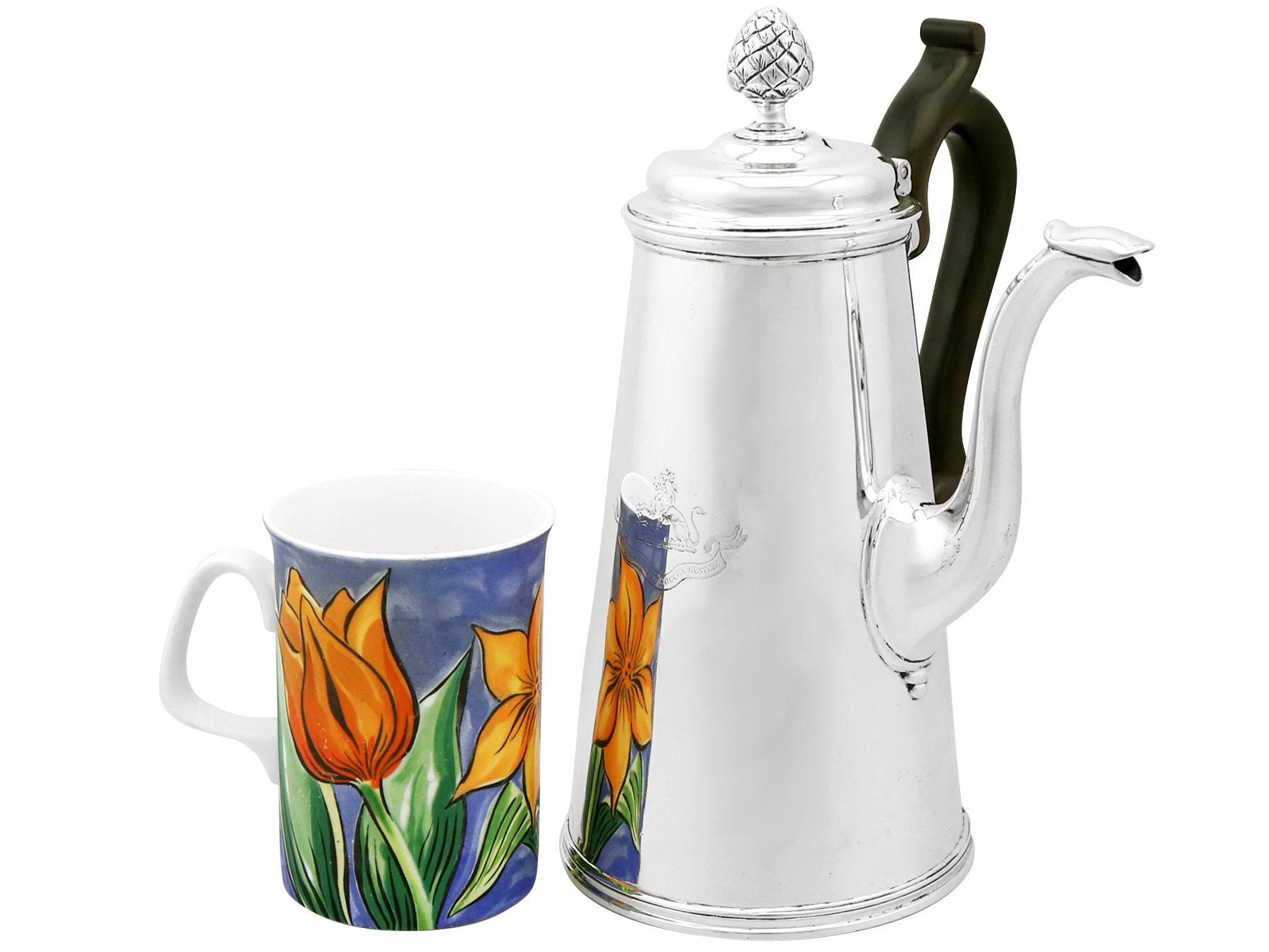 An exceptional, fine and impressive antique Victorian English sterling silver coffee pot; an addition to our silver teaware collection

This exceptional antique sterling silver coffee pot has a plain tapering cylindrical form with a moulded base,