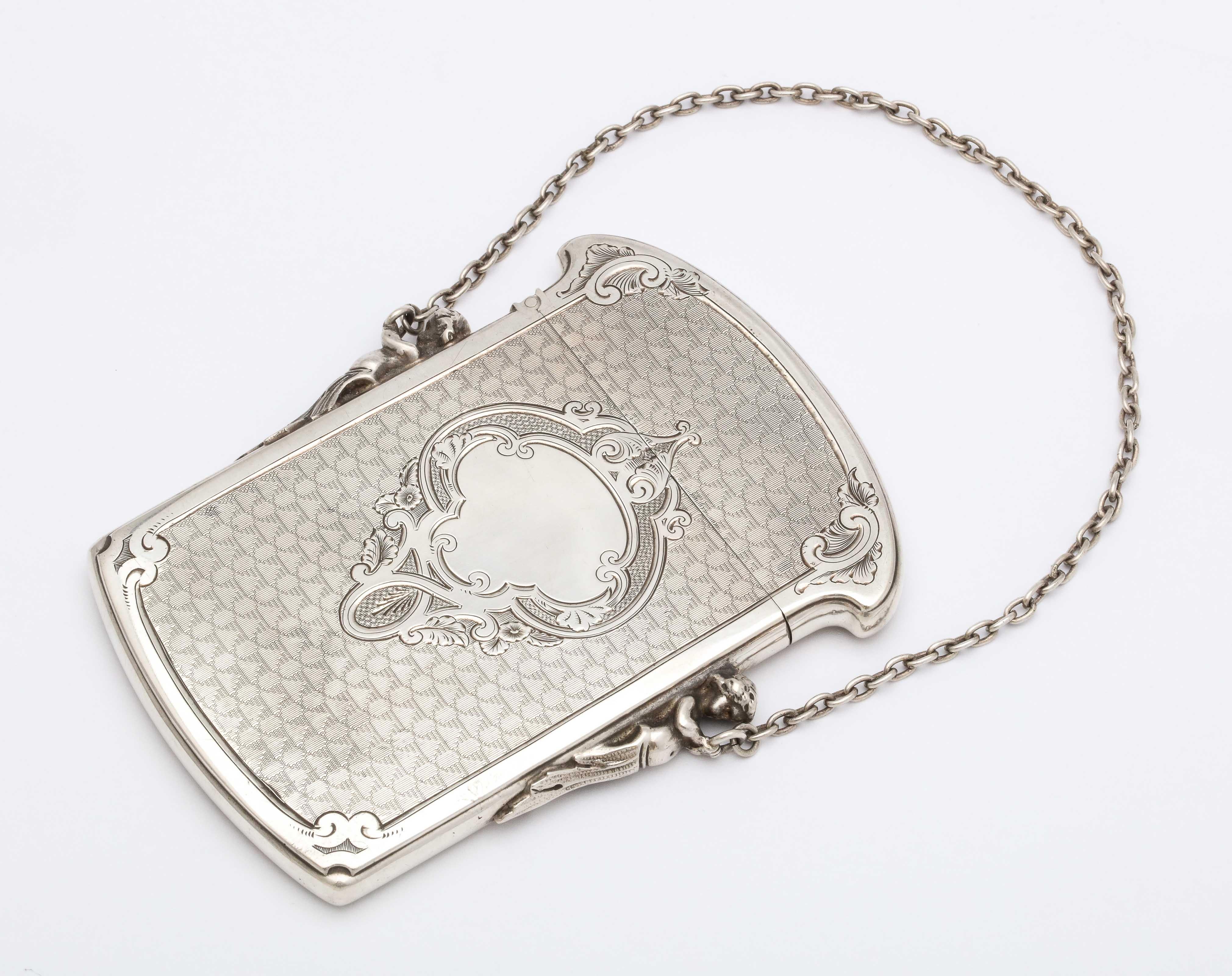 Victorian, Coin Silver (.900) calling card/ business card holder, Gorham Manufacturing Co., Providence, Rhode Island, circa 1860-1870. Two figures (one on each side) are holding the case's original, silver link chain. Engine turned design. Has a
