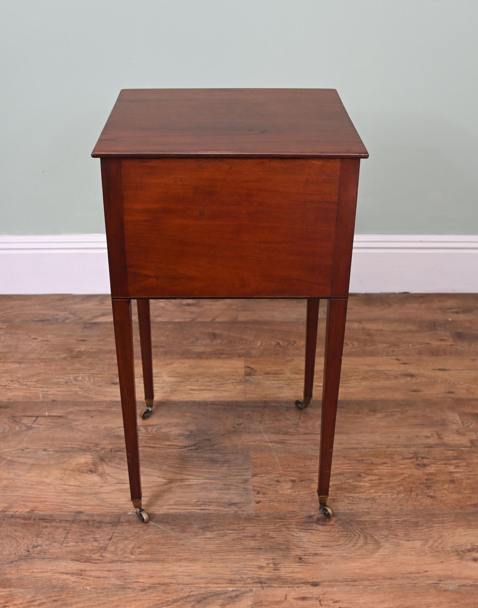 You are viewing a gorgeous period Victorian collectors cabinet
Crafted from mahogany with satinwood stringing on drawers
Top opens up to reveal glass top section for displaying, great for jewellery
On original wheels at end of tapered legs
We date
