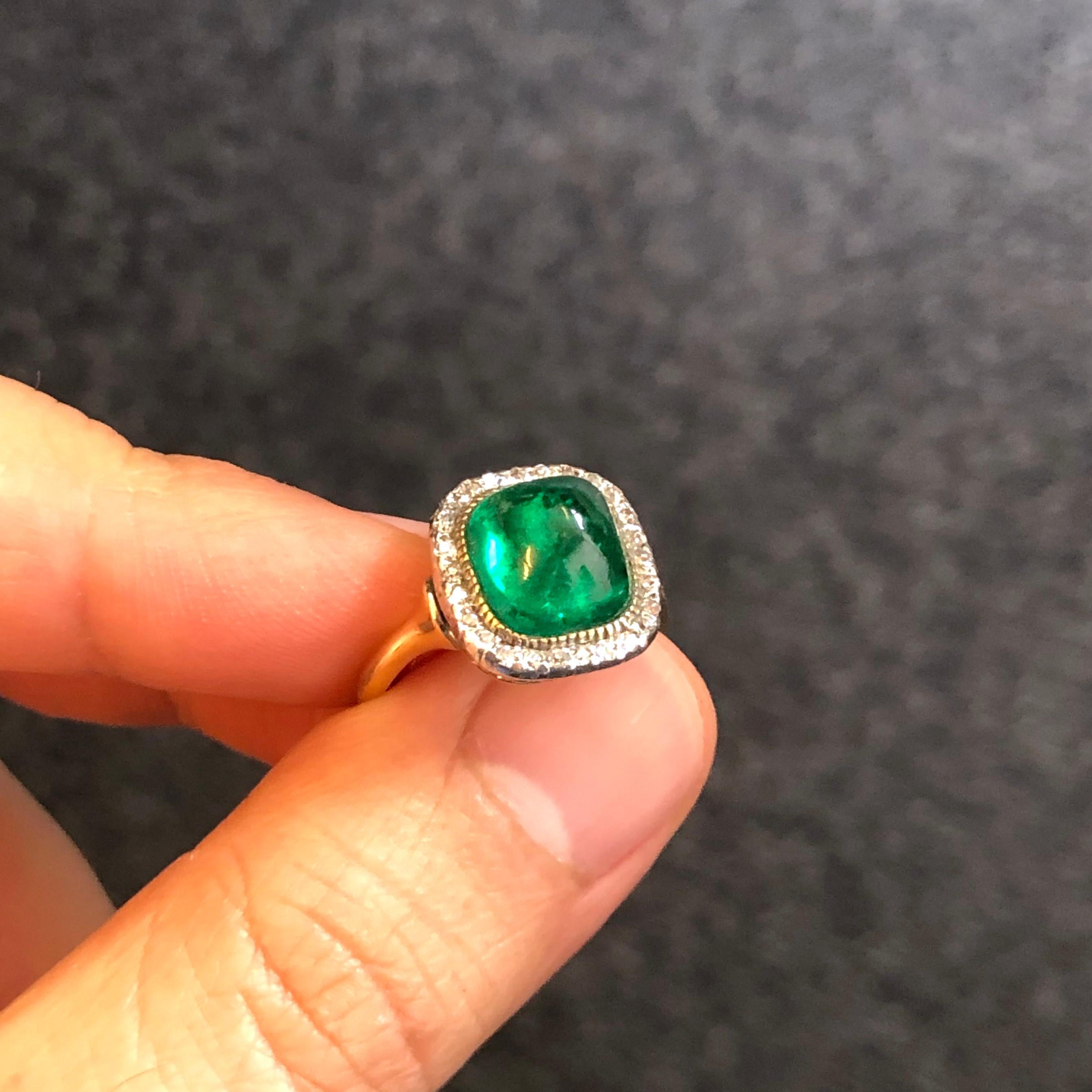 A beautiful Colombian Sugarloaf Emerald and Diamond Ring, ca. 1890s

The sugarloaf emerald cabochon of ca. 5 carats, is of very saturated colour and transparency and is an excellent example of 