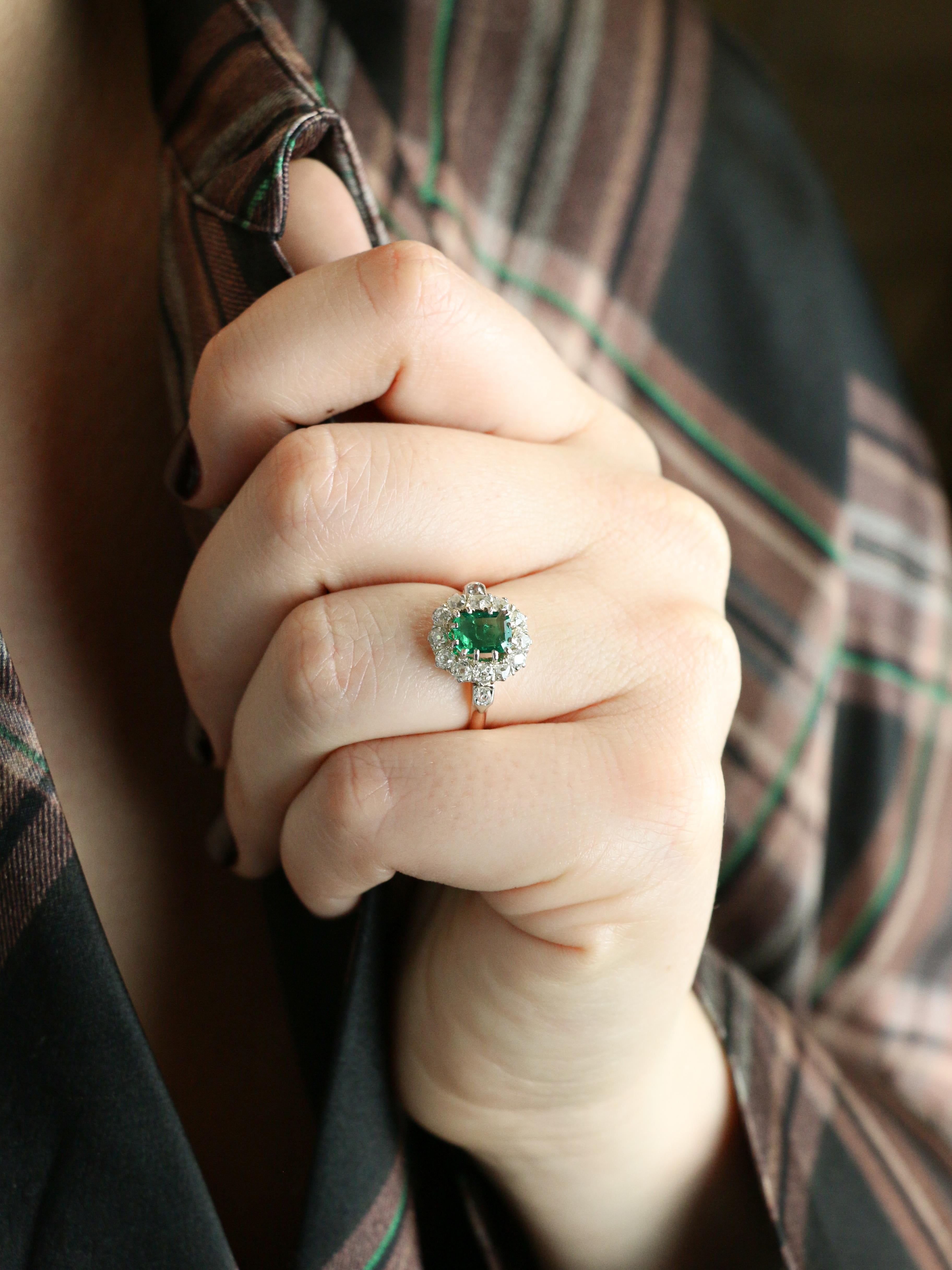 Antique pink gold diamond emerald ring

Cluster ring in 18k (750°/°°) pink and white gold set with an Intense Green Colombian emerald weighing approx. 0.70 carat (7 x 5.1 x 2.83 mm) in a surround of 13 Old Mine Cut diamonds of fine quality, total
