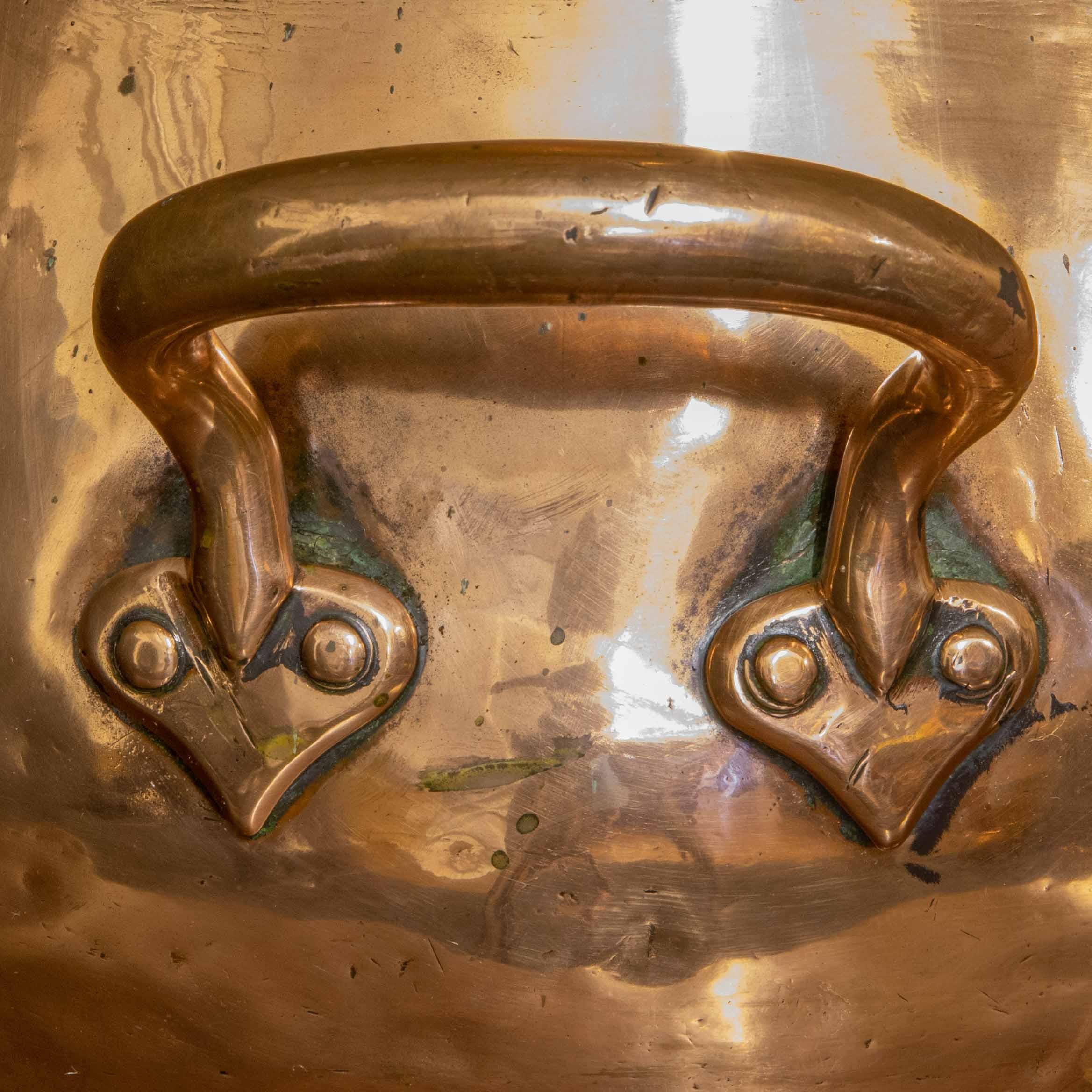 This is a large four gallon harvest flagon from the Victorian period. Of a typical pear shaped form, made from heavy gauge copper and with a superb additional hand to the front with wonderful heart shapes to it's fixings. This piece has been well
