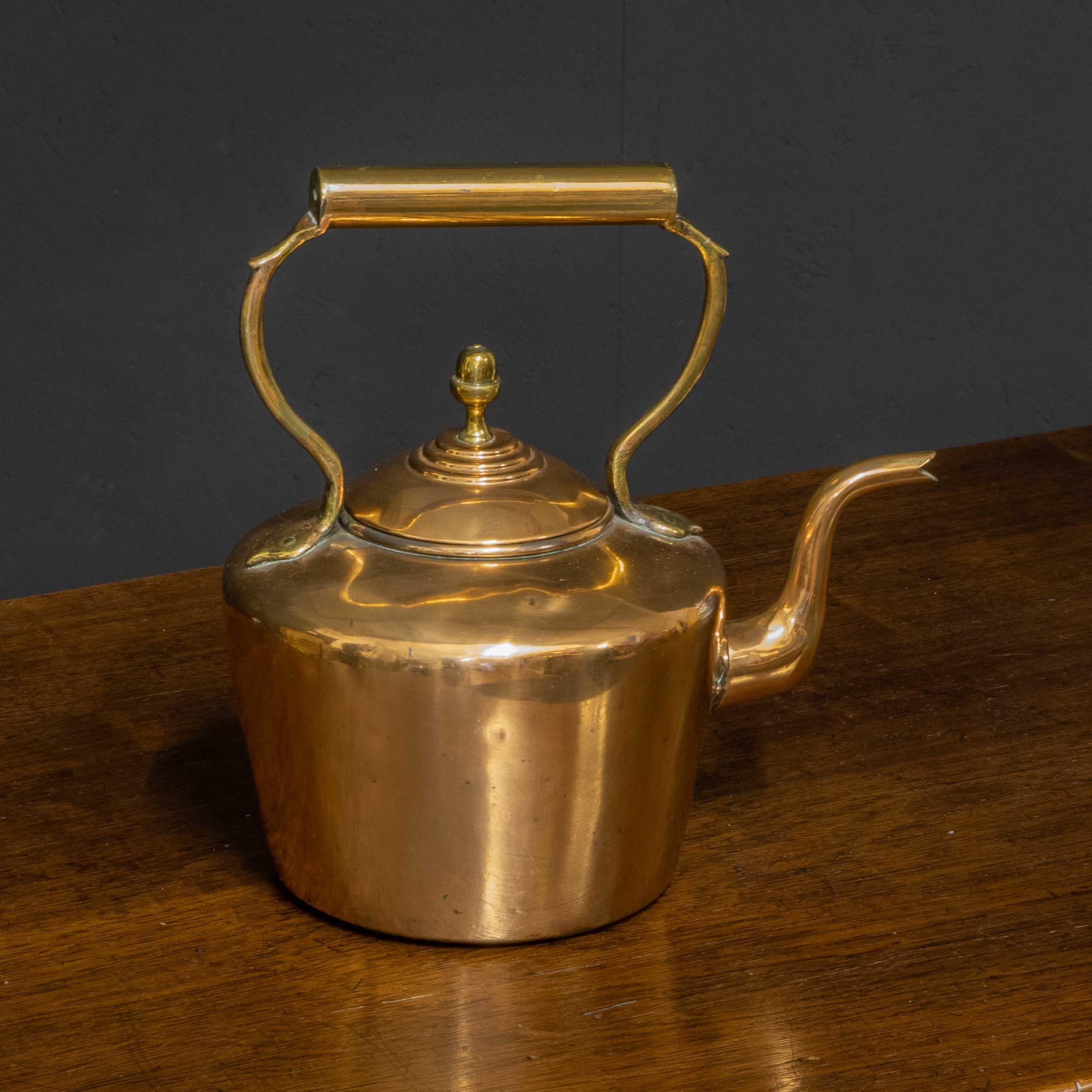 A good mediium sized copper kettle of typical design but in above average condition. The domed lid and acorn finial are particularly pleasing.
      