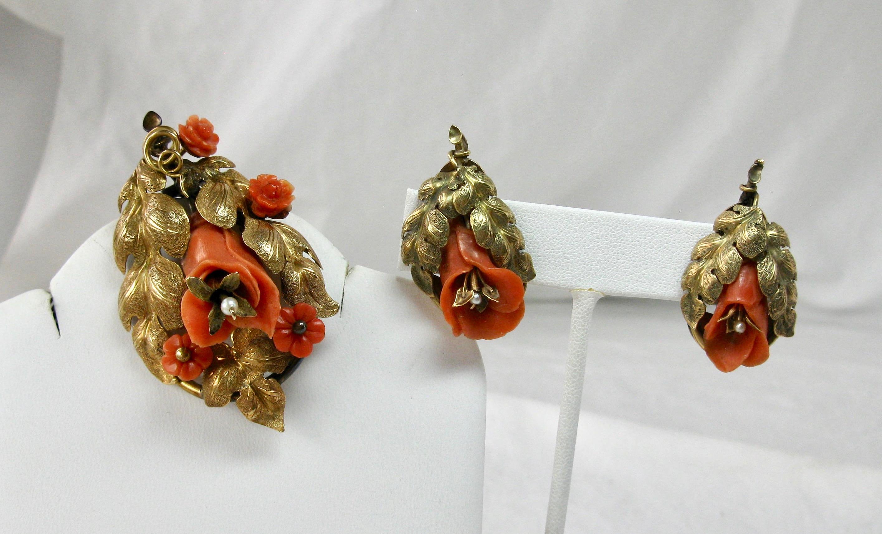 This is a rare pair of museum quality Etruscan Revival Victorian Coral Earrings and Brooch.  The parure set has gorgeous hand carved three dimensional flowers of natural coral.  The carving of the flowers is absolutely exquisite!  The larger flowers