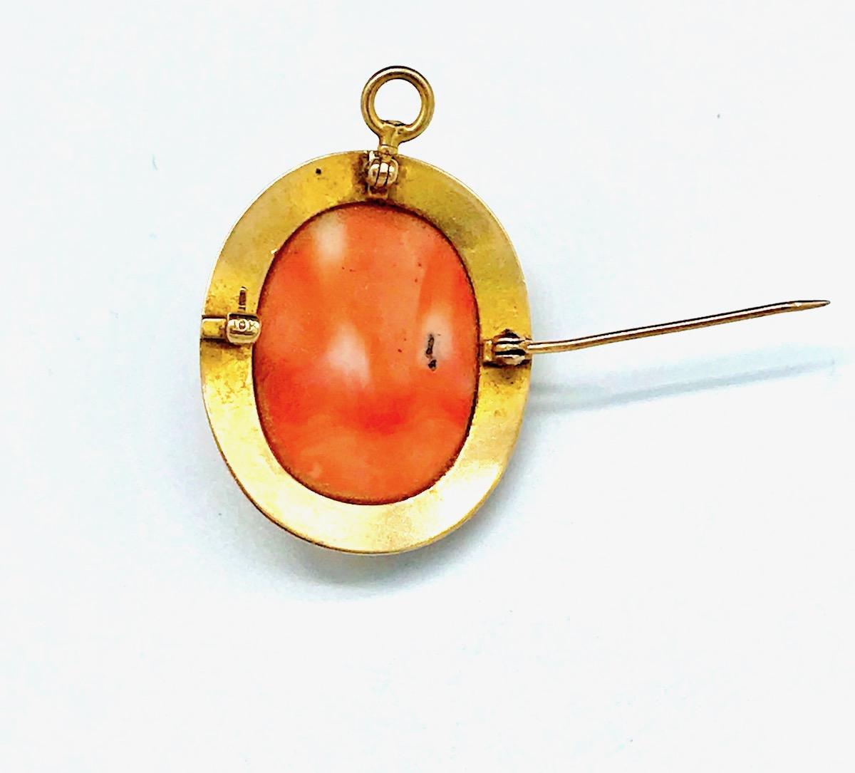 Gold, Victorian Coral Cameo Pin 
Vintage, framed coral hand-carved cameo set in 10 karat yellow gold. 
Measures 1-1/2 inches, widest