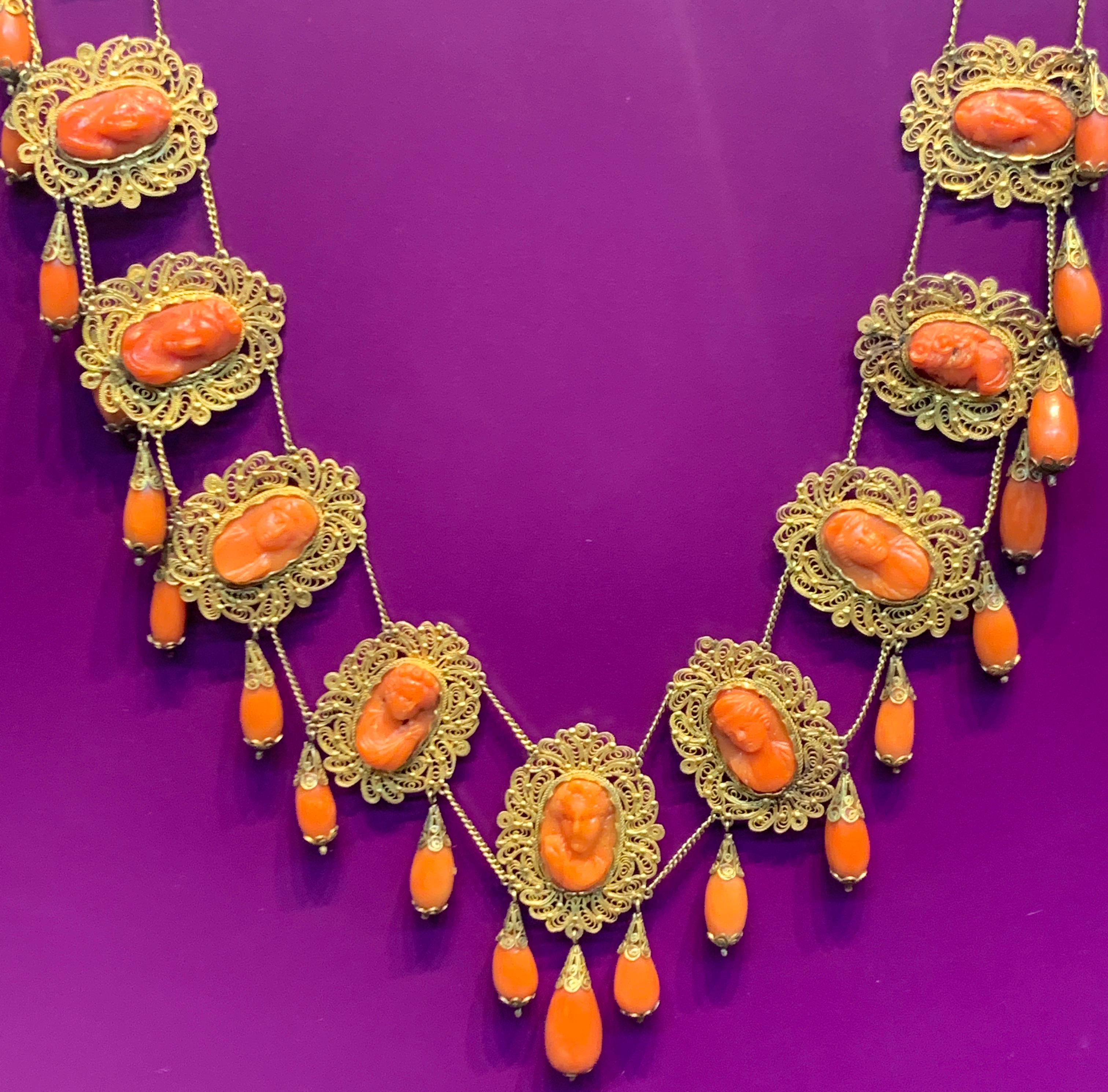  Victorian Coral & Gold  Cameo Drop Necklace, made circa 1900 ,14K Yellow Gold including 14 coral cameo's & 27 coral drops 
66.5 grams
Measurements: 19