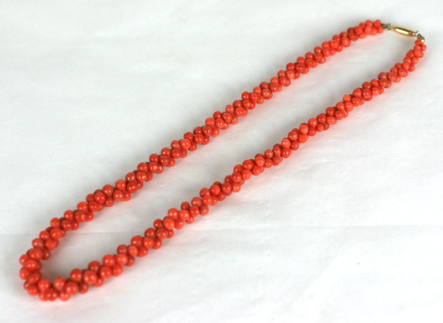 Elegant Victorian Coral Graduated Toggle Necklace composed of hundreds of hand carved coral beads in the shape of barbells which form a 