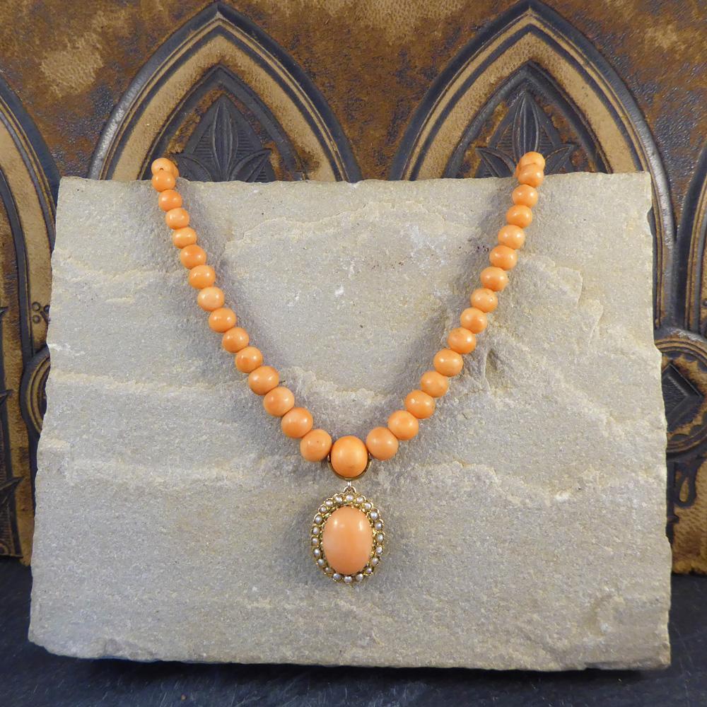 This antique necklace has been created using Coral graduated beads, ranging from 4mm to 9mm in diameter, which was a prized material used in this romantic period in the Victorian era. Finishing off this beautiful Coral necklace hangs a pretty and
