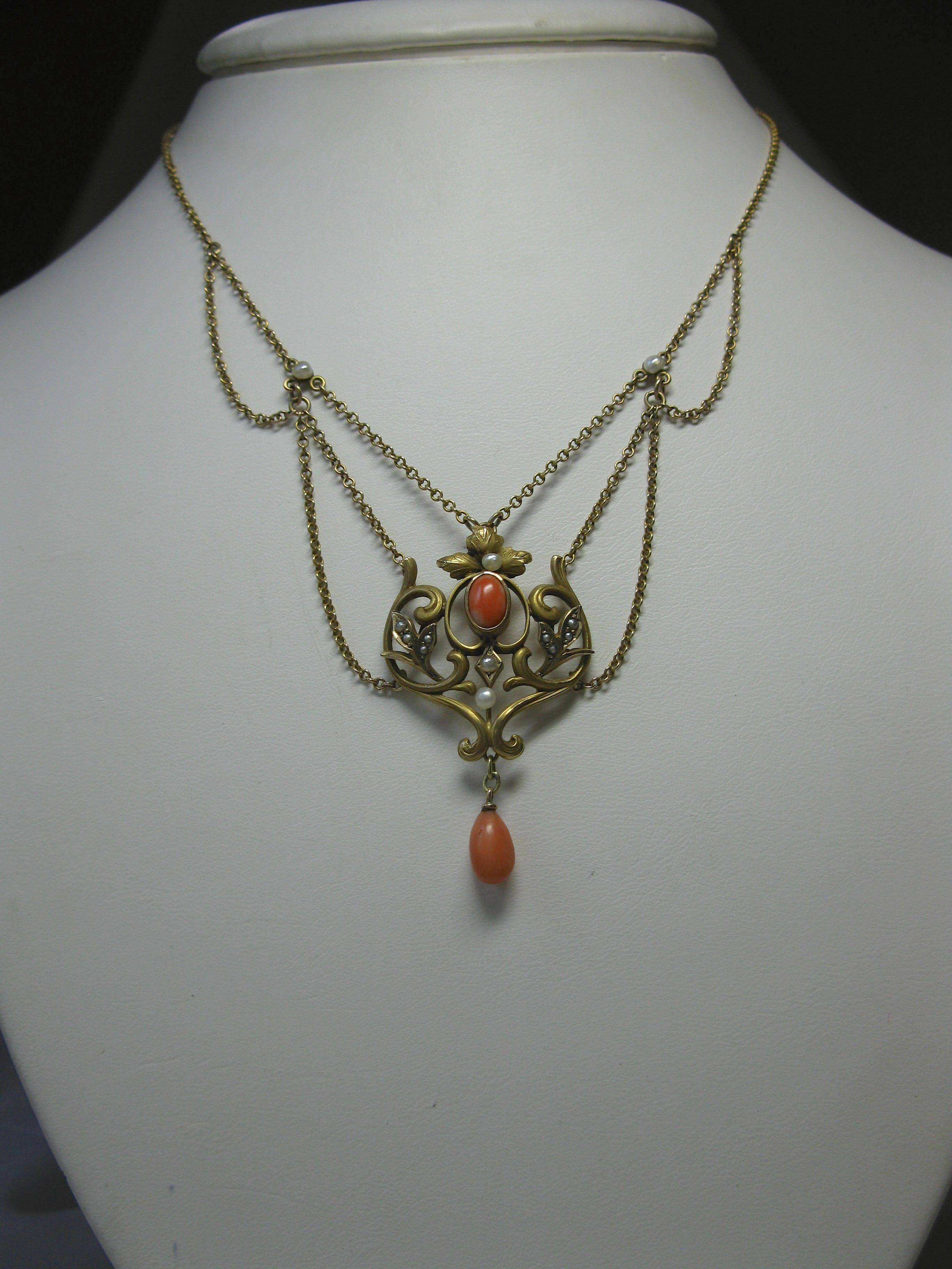THIS IS A STUNNING VICTORIAN - ART NOUVEAU - BELLE EPOQUE FESTOON NECKLACE WITH THE MOST GORGEOUS NATURAL SALMON CORAL CABOCHONS AND PENDANT WITH SEED PEARLS IN A CLASSIC FLORAL FLOWER MOTIF OPEN WORK SWAG DESIGN IN 10K ROSE GOLD DATING TO CIRCA