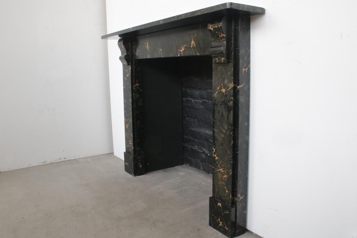 Victorian corbeled slate surround retaining its original Portoro marble paint finish in excellent condition.

For detailed sizes please see the size diagram in the image gallery.


