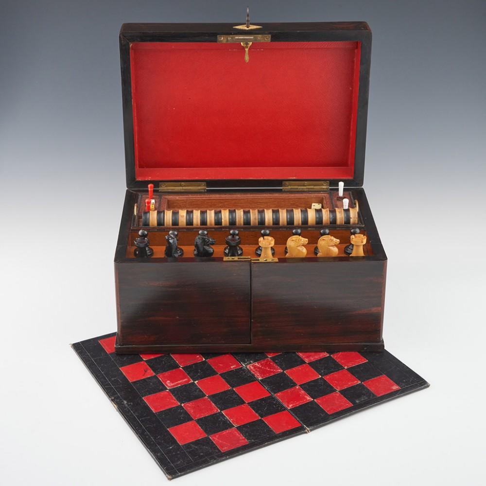 Heading : Victorian coromandel games compendium
Date : c1880
Period : Victoria
Origin : England
Decoration : Contains: Chess, Draughts and Backgammon board, all chess pieces mounted on fold out doors, four dice, backgammon counters, two sets of