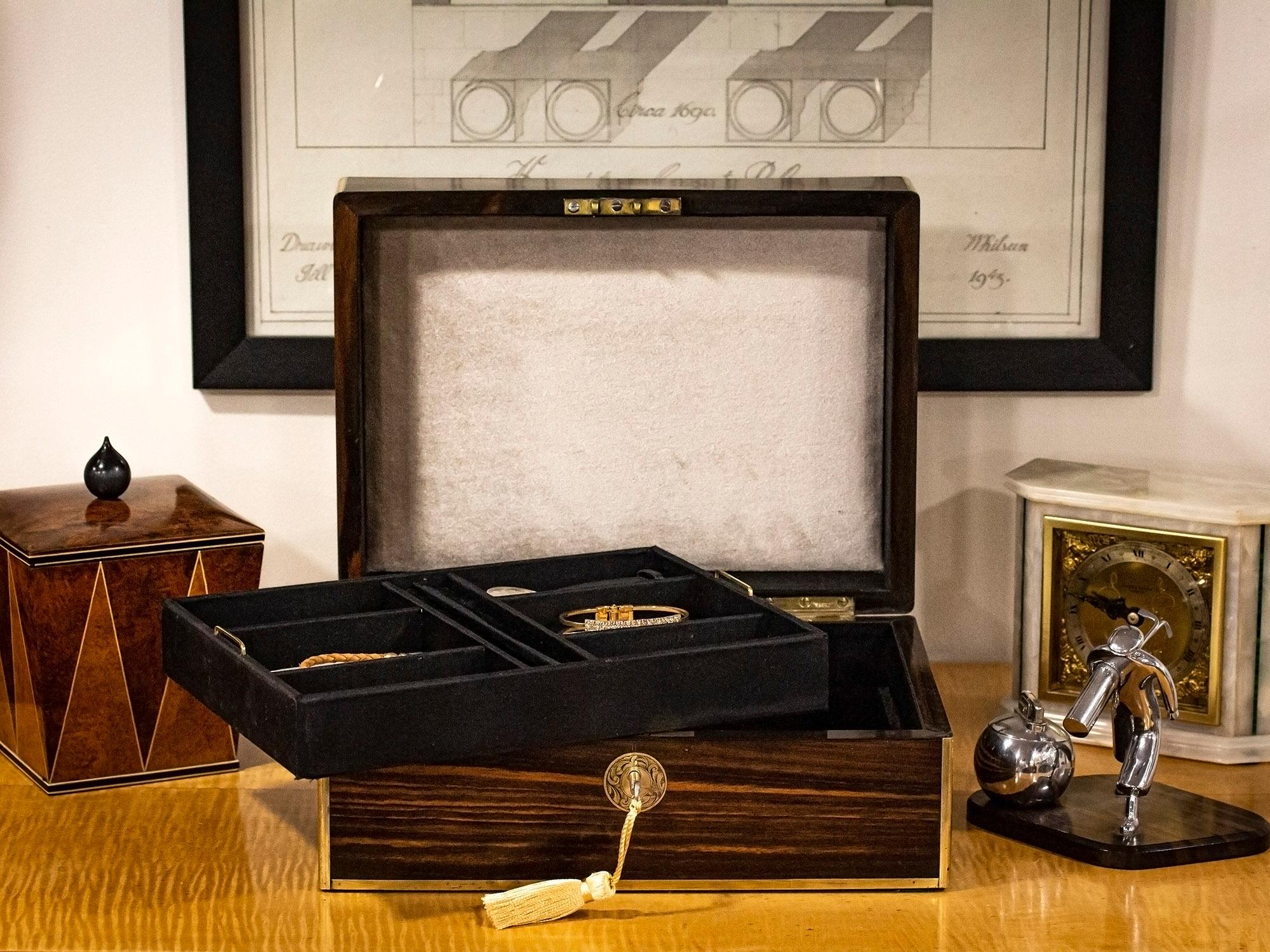 Fitted with a Removable Partitioned Tray

From our Jewellery Box collection, we are delighted to offer this Victorian Coromandel Jewellery Box. The Jewellery Box of rectangular form with quadrant brass edging veneered in exotic Coromandel with an