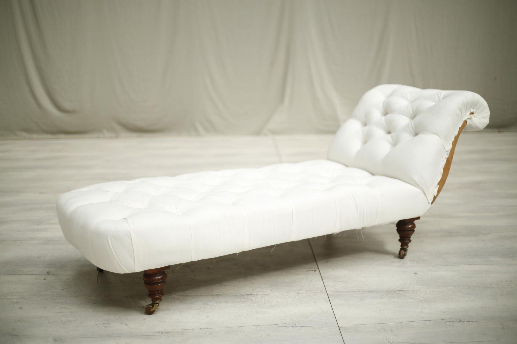 This is a very well made English country house chaise longue. The deep buttoned detail and simple scroll back shape make this extremely elegant. It will work well in a number of interiors as the design is ageless and the fabric choice will dictate