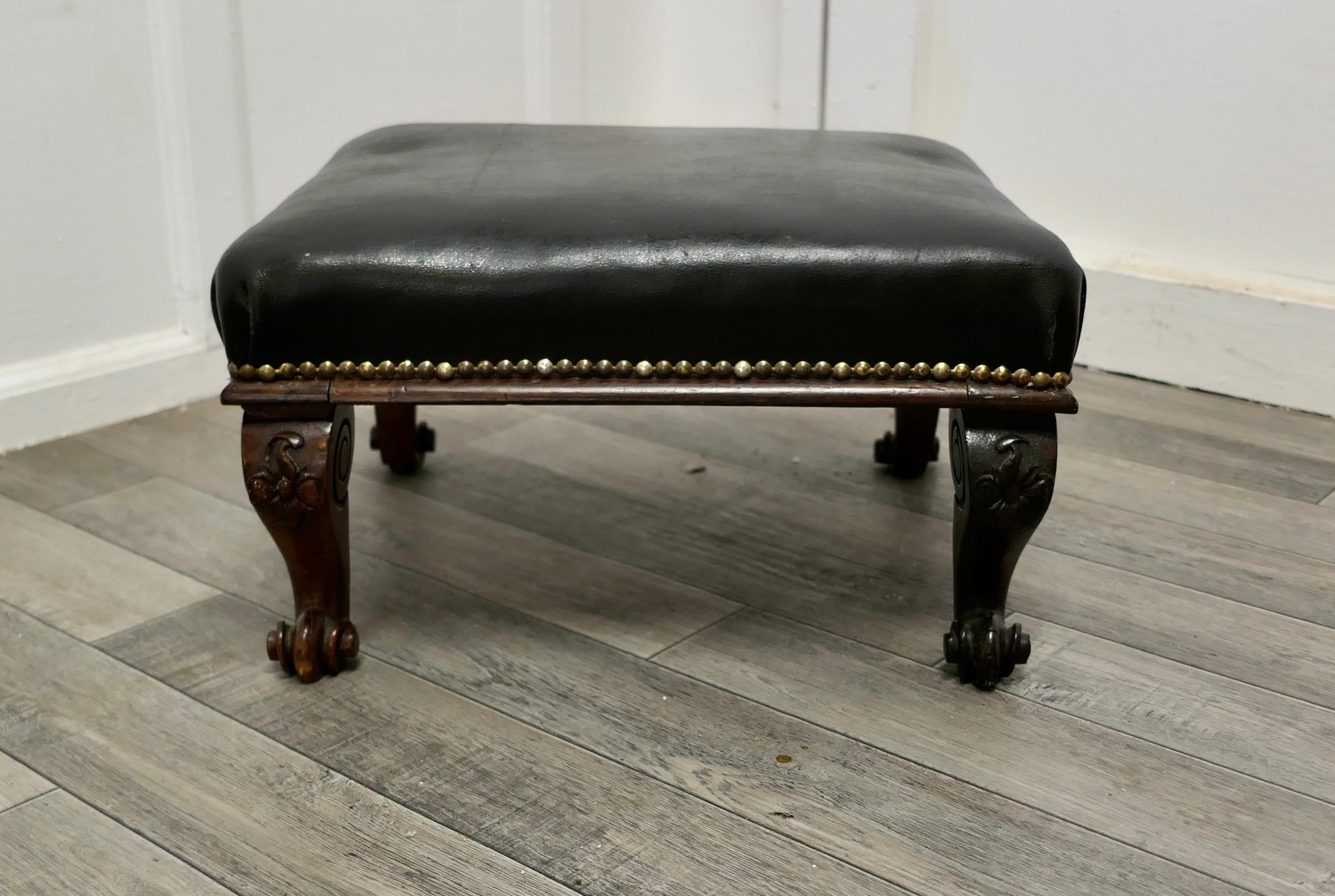 Victorian Country house foot stool upholstered in leather 

A Lovely piece, this Victorian stool stands on carved cabriole scroll legs and has dark almost black studded leather upholstery 

The stool, is in good antique condition, it is 10”