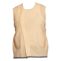 Chemise victorienne asymétrique boutonnée sans manches en laine crème