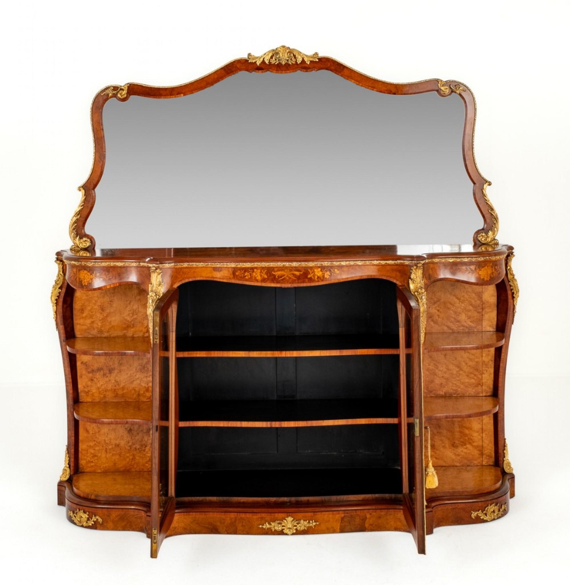 Wonderful Victorian Burr Walnut Mirrored Back Credenza.
Circa 1860
Here we Have a Superb Quality Credenza Standing upon a Plinth Base.
Featuring 2 Central Glazed Doors with Shelves within.
Circa 1860
The Shaped End Sections Being of an Open Form