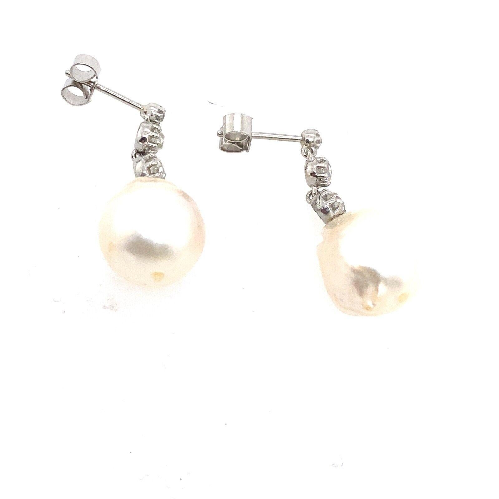 This is a pair of Victorian cut Diamond drop earrings set with 0.30ct Diamonds and 2 Cultured Pearls. 
This pair is a perfect choice for any occasion to wear as it is stylish and comfortable. It is crafted from Platinum with peg and butterfly